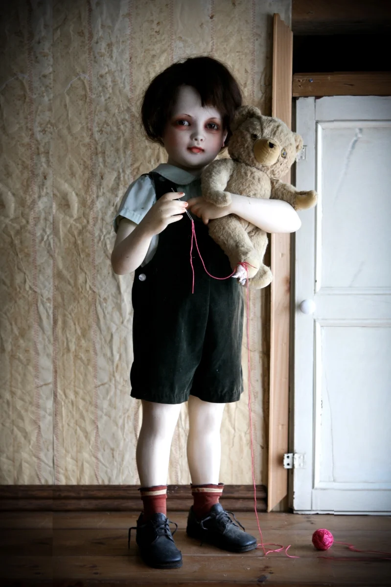 Little Fixer, Assemblage, vintage mannequin, vintage teddy bear,wig, vintage child clothes,shoes,socks, needle, yarn, 16"x36"x14, 2011