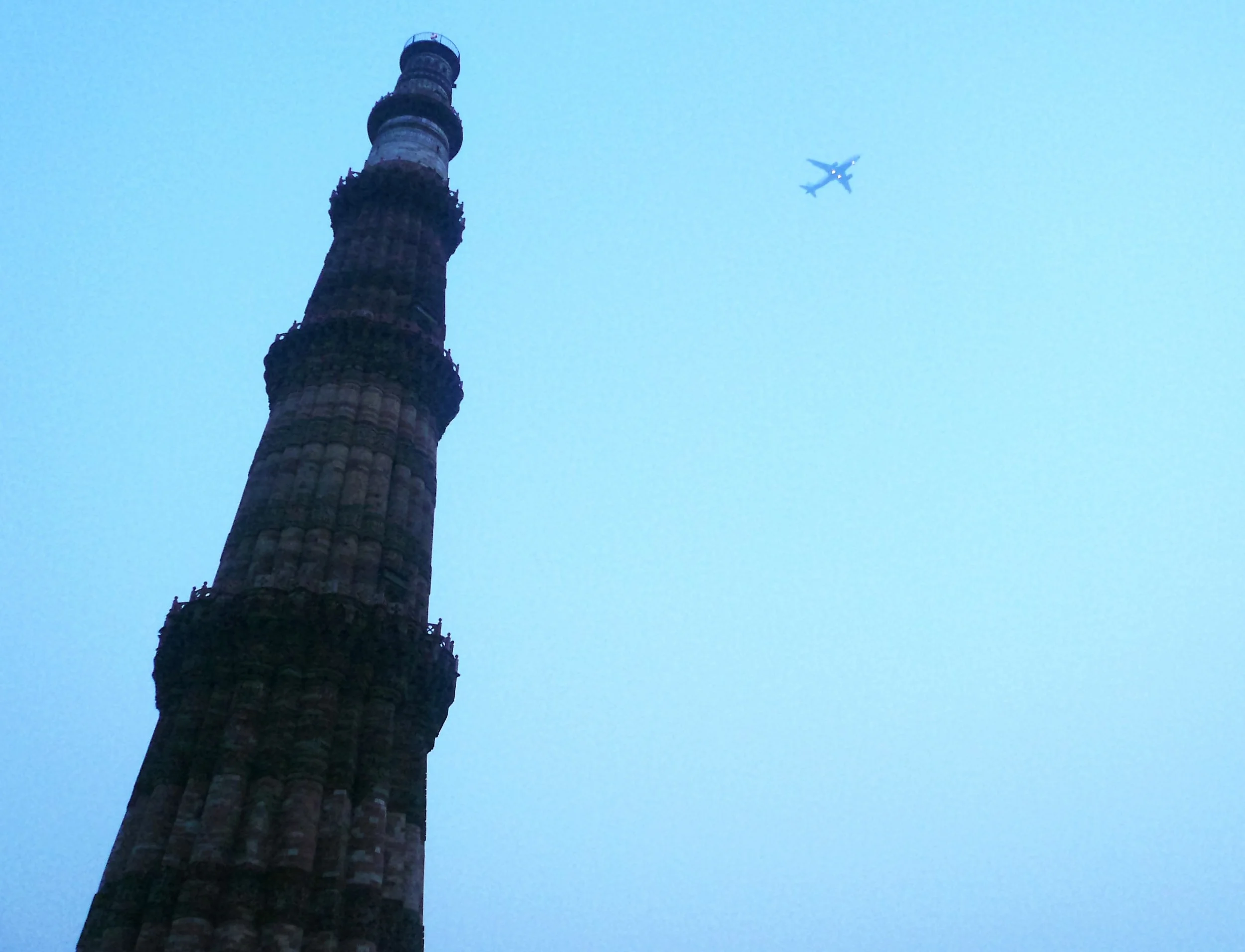 Qutab Minar and an Airplane