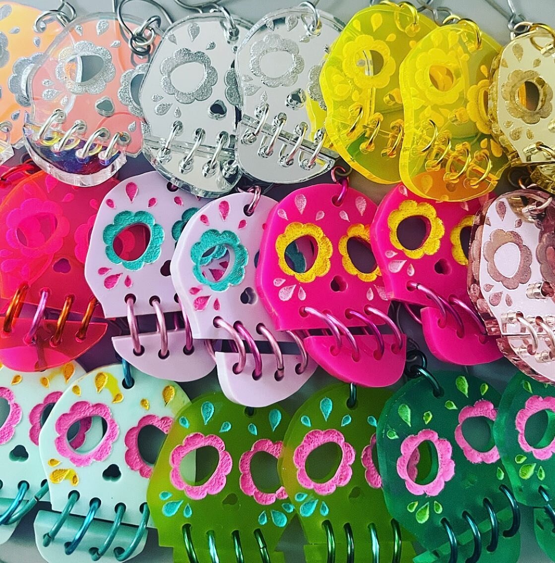 Iridescent, neon, metallic, pastel, and vibrant colored acrylic fall earrings. Now available in my Etsy shop! https://www.etsy.com/shop/Mekunia #halloweenjewelry #sugarskull #diadelosmuertos #rainbow