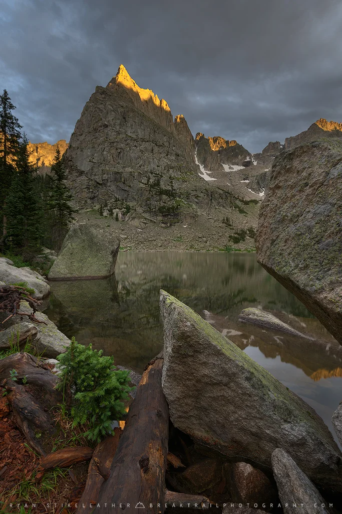 A ribbon of warm sunset on the tip of Lone Eagle Peak