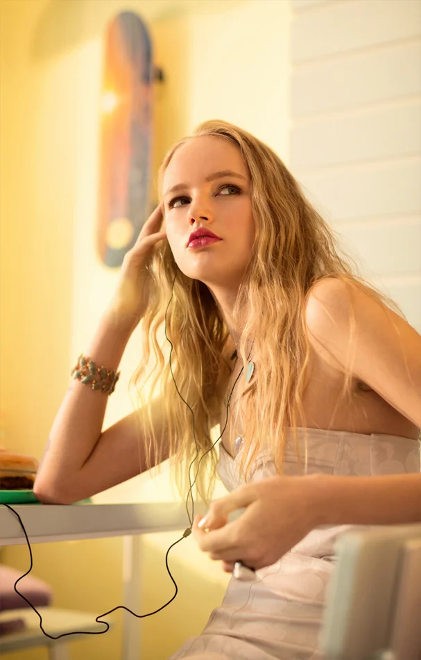 LA surf and skate Fashion editorial photoshoot. Model listening to music with wet beach hair. Daniel Allison photography.