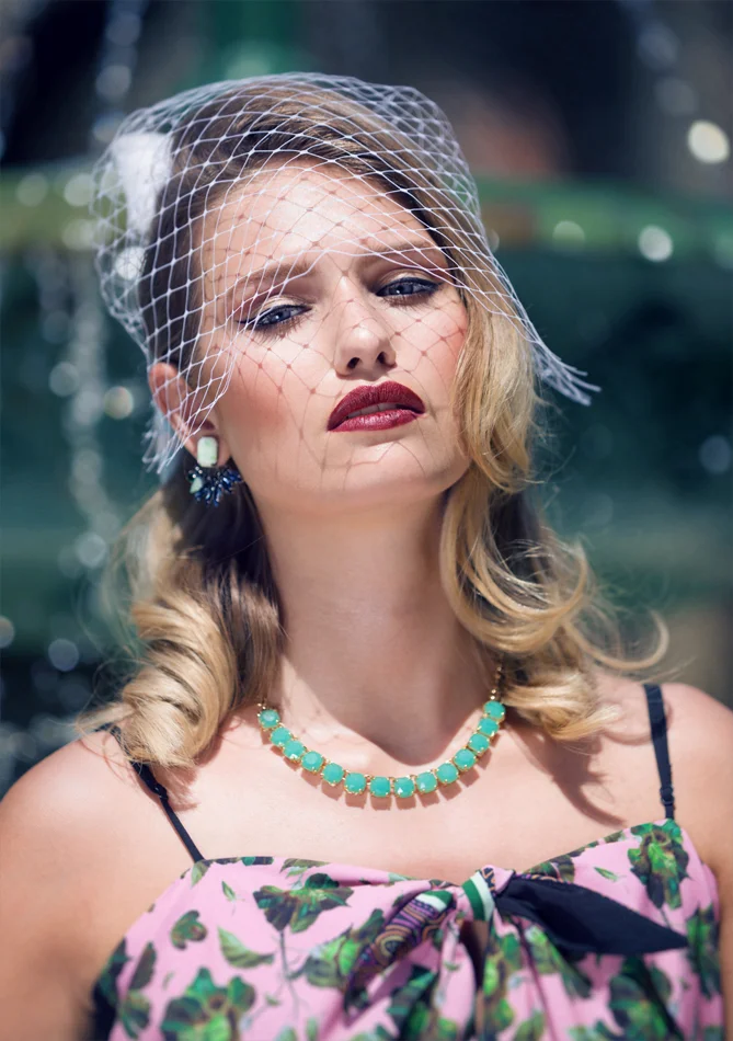 Dubai World Cup womens fashion editorial photoshoot. Model posing in front of a water fountain. . Daniel Allison photography