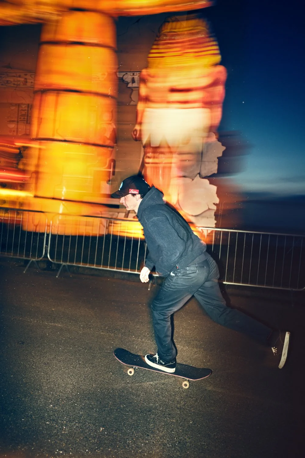 Palace Skateboards rider Danny Brady photographed during the Blackpool Illuminations using creative front flash photography. Authentic skateboarding, youth culture and streetwear photography by commercial photographer Daniel Allison.