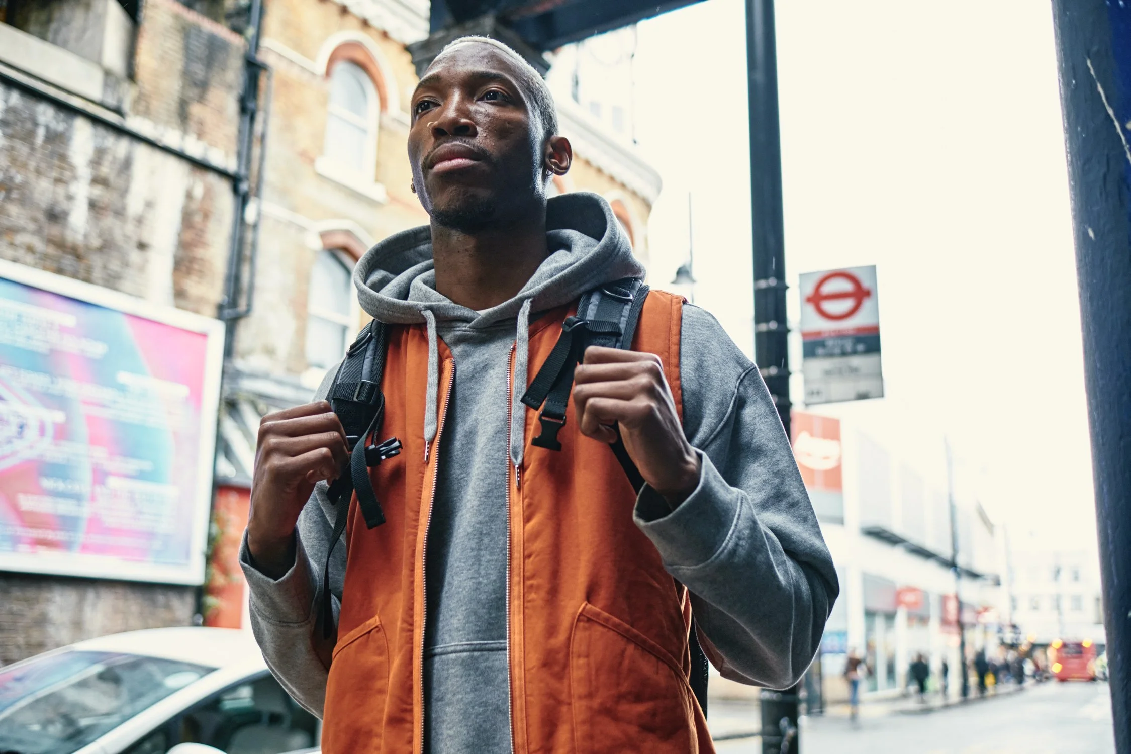Model carrying an Eastpak Quidel Powr backpack on location in London during a streetwear campaign shoot.