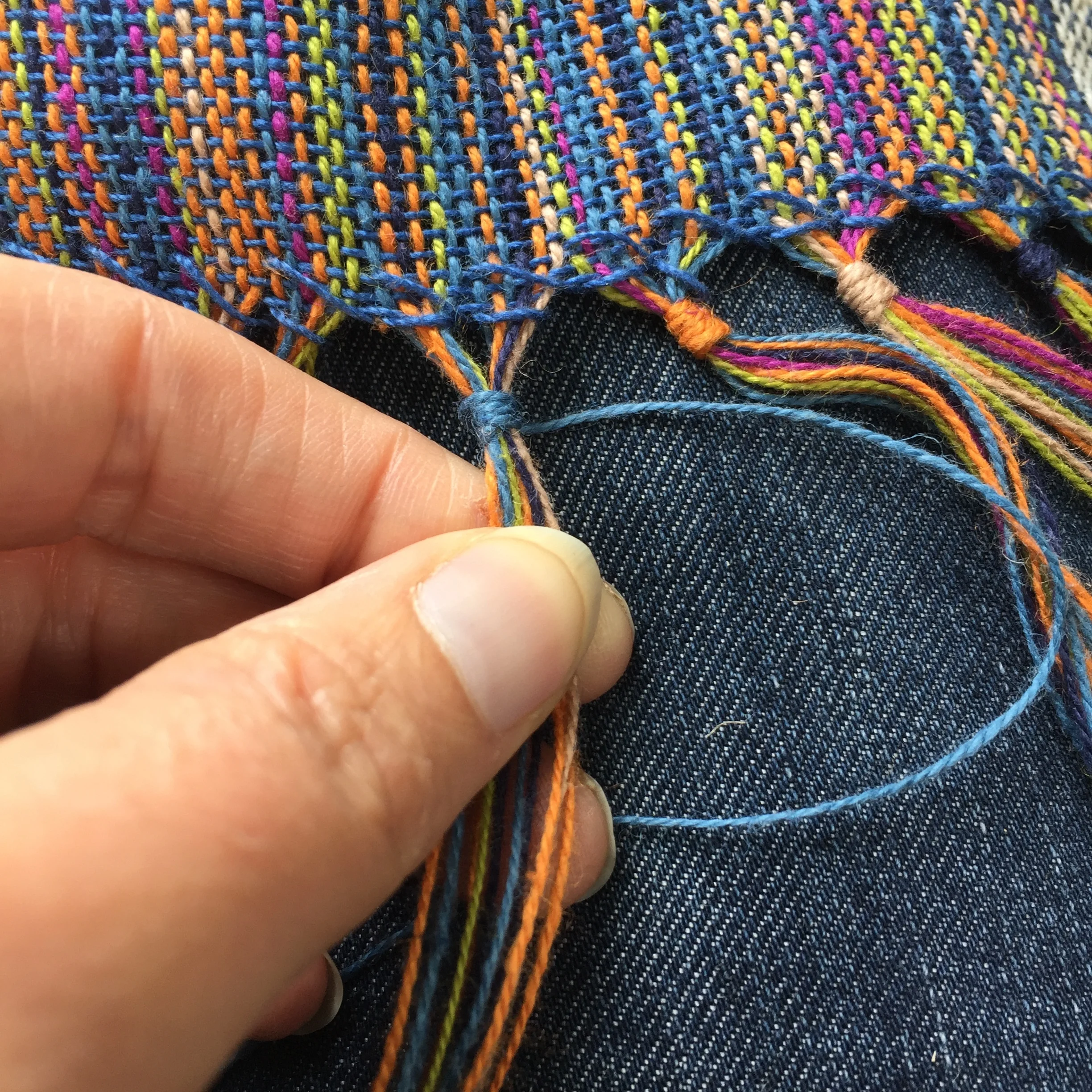 Hand wrapping the fringe before washing