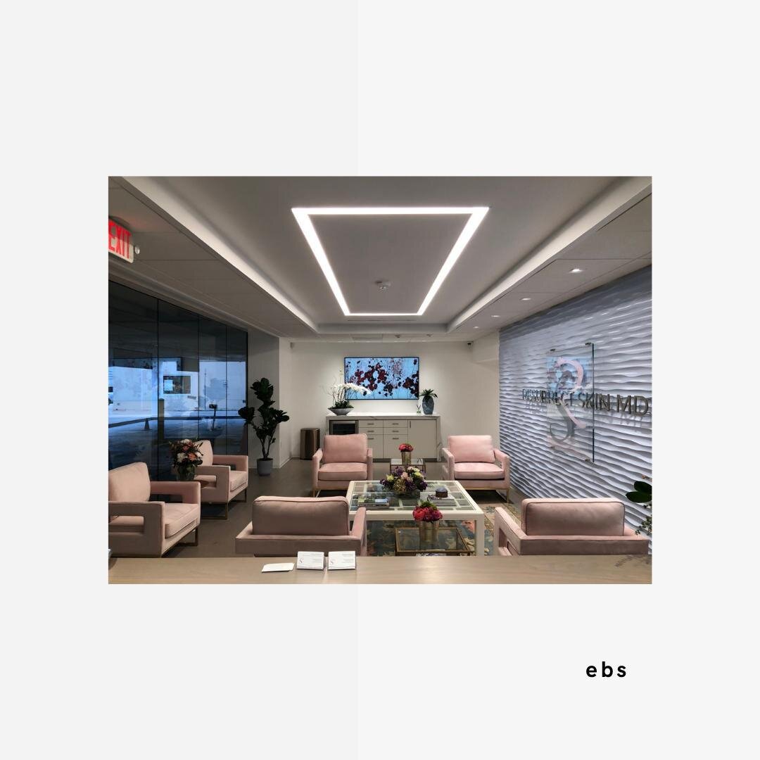 In this side view from the reception desk, we can appreciate the finished Resurrect Skin's reception and logo. Thank you for following along with us on this project's journey! We have enjoyed the process and are very excited that Dr. Burns and her pa