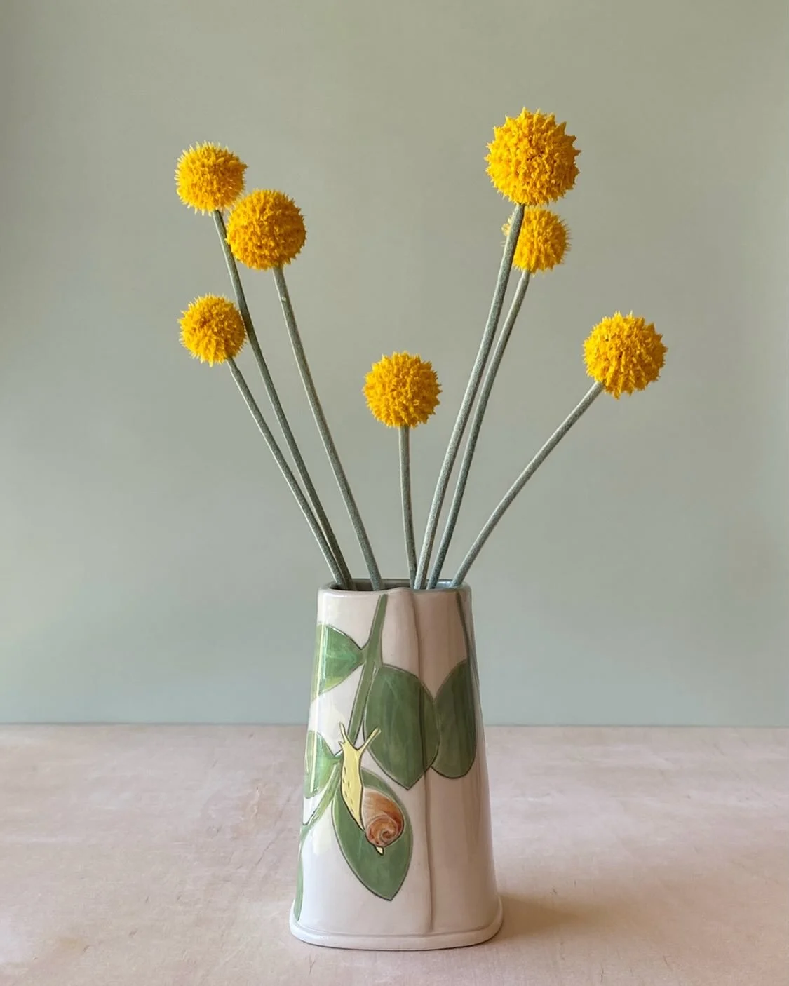 In my story poll the other day you all mostly voted for snails and flowers on vases. 
I already had a few in the kiln and I&rsquo;m happy to report they came out so lovely. 
Here&rsquo;s a snail vase for starters. 
This will be with me at TN Craft th