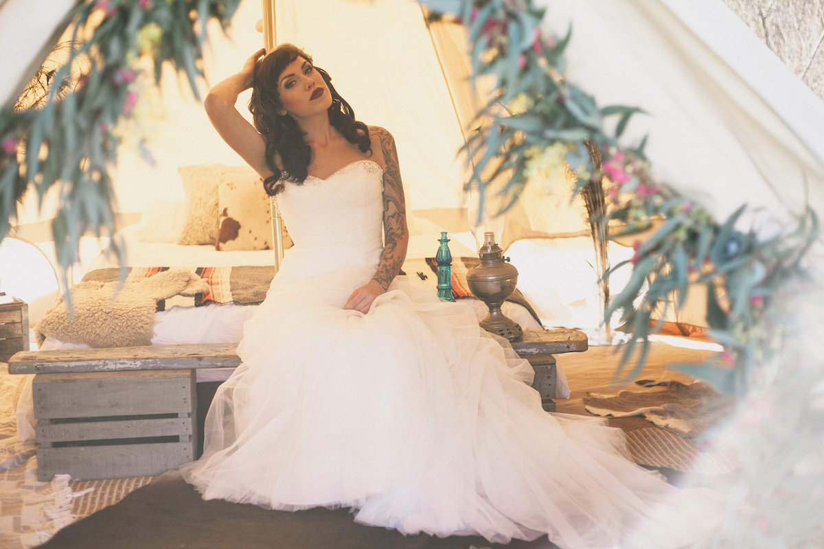 Tinker Tin's bell tent was styled into this dreamy outdoor honeymoon suite, creating the perfect setting for this outdoor Bohemian wedding inspiration shoot! Photo by Alexandra Wallace.