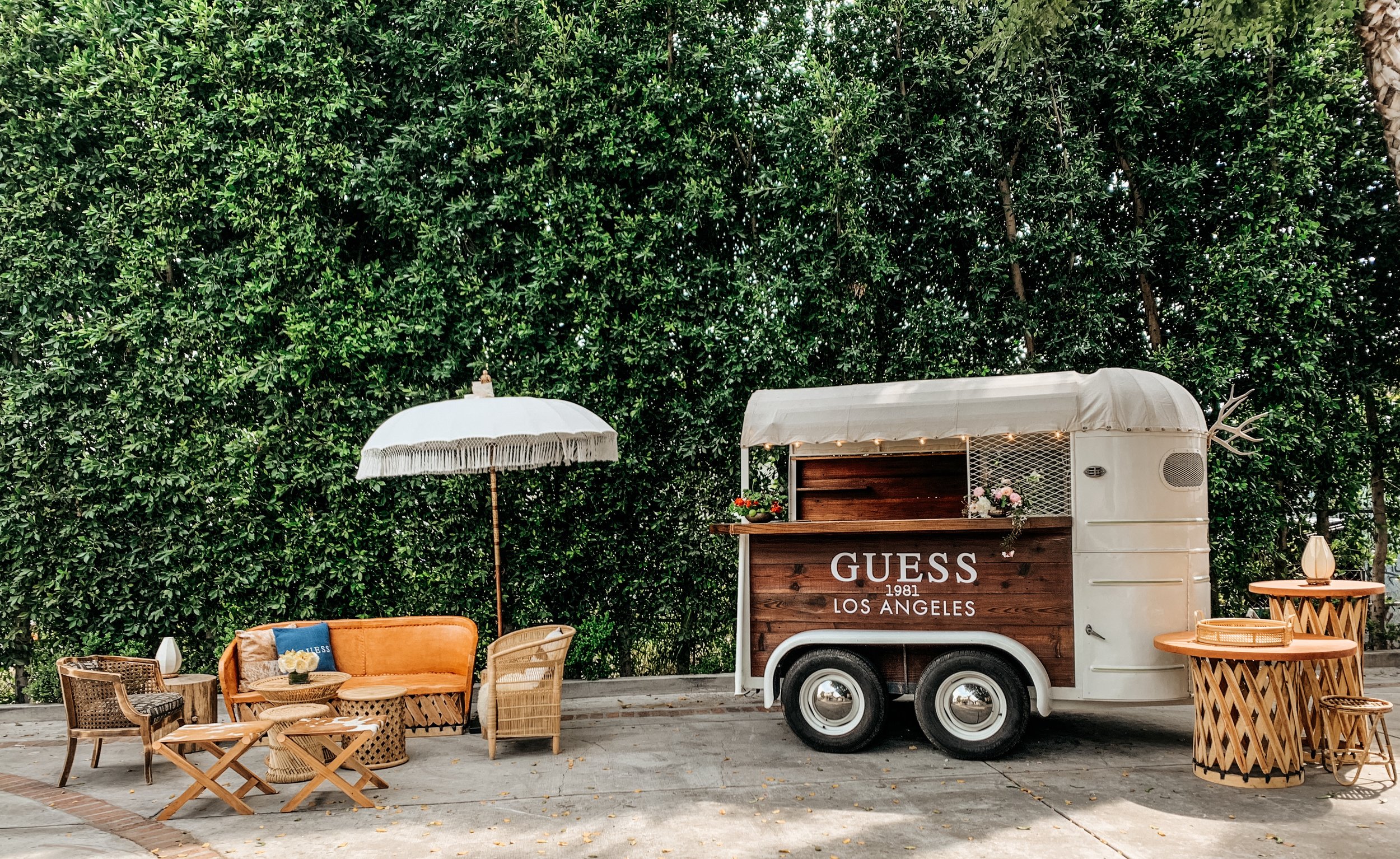 Custom branded vintage trailer trailer with styled lounge + step &amp; repeat wall for rent