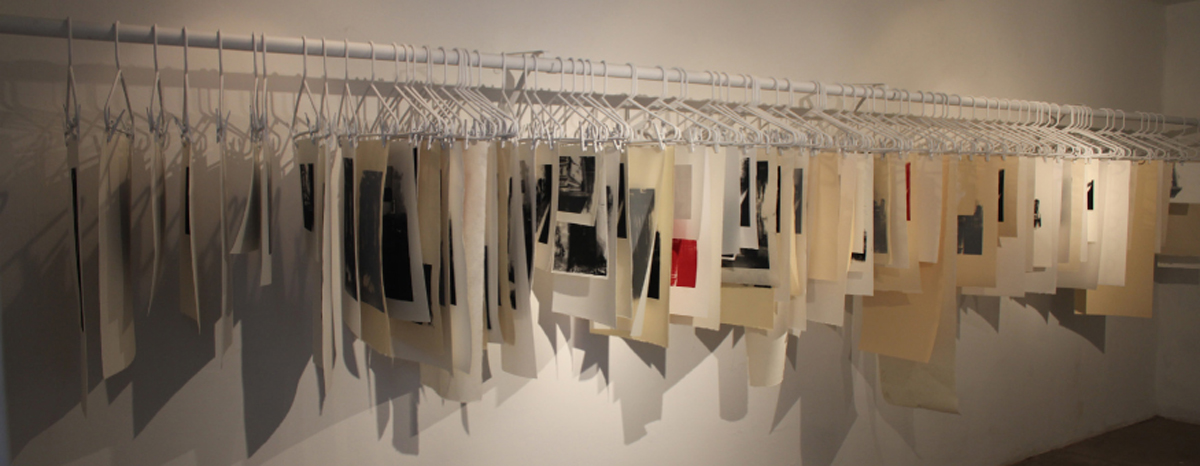   (De)Constructing Memory   Serigraphs on paper and mylar, hangers, closet rod  2011 