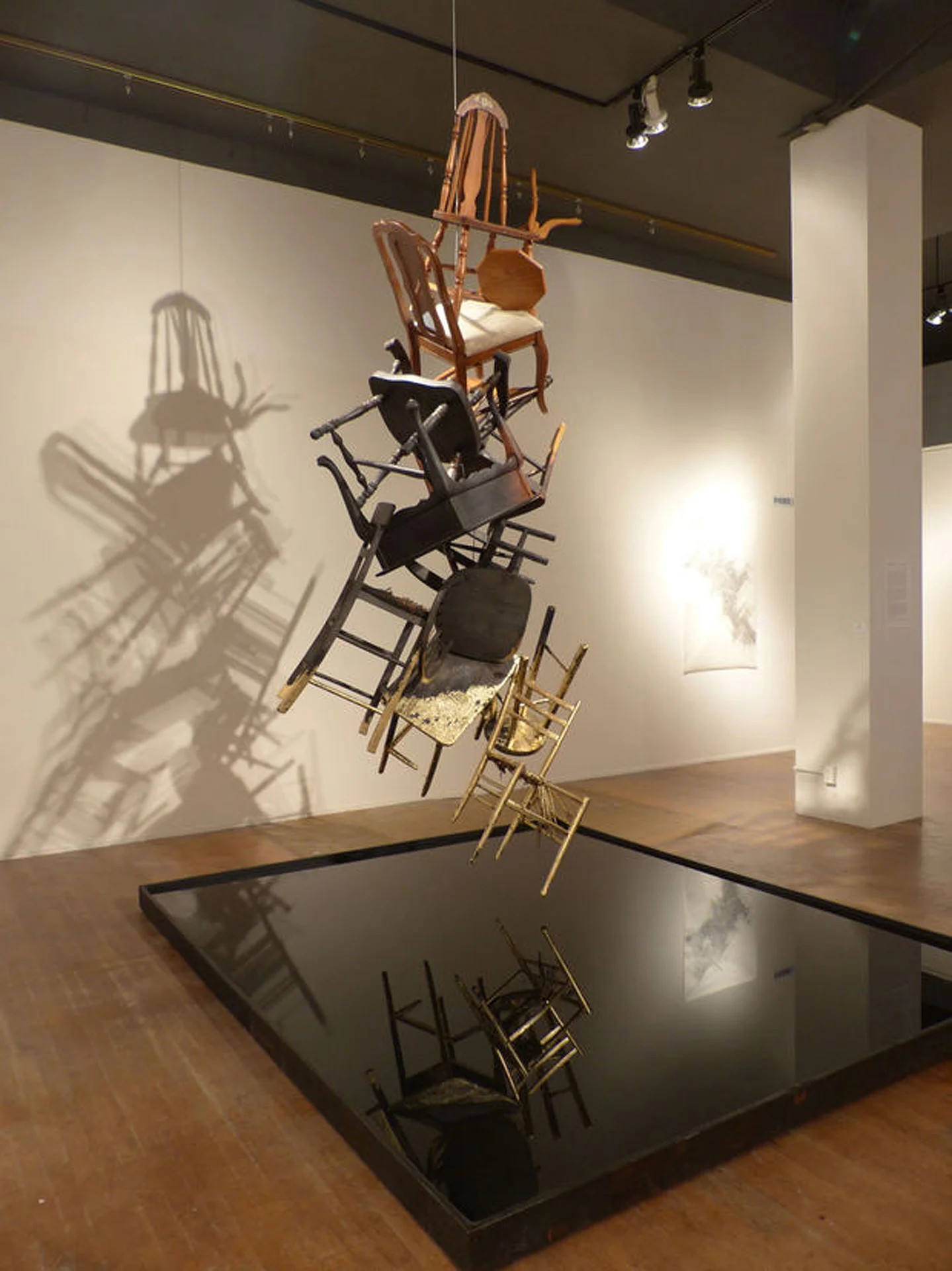Phoenix Furniture, fire, gold leaf, wood, and water Installation at the Coos Art Museum 2015