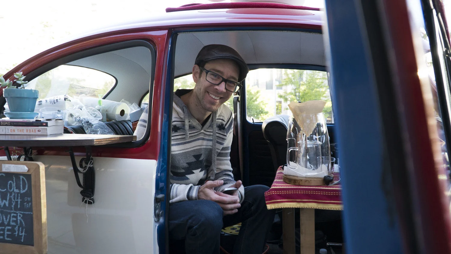 Denver’s Matthew Pendleton preps for the day at On The Road Coffee, his Volkswagen-turned-cafe that serves curious passersby around the city. (Sophie Hoover/The Denver Post) Denver’s tony Volkswagen cafe is half coffee, half commute
