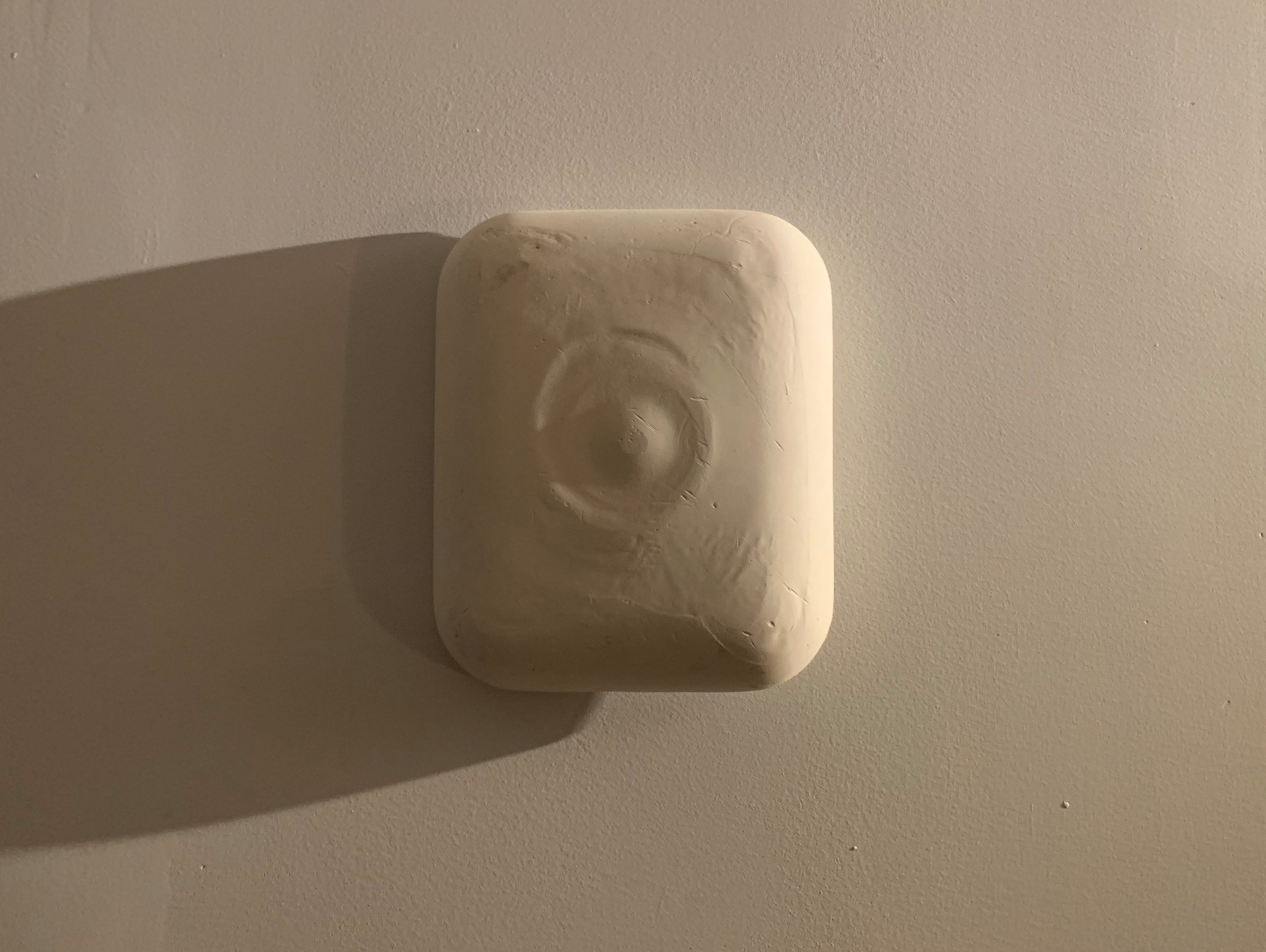 The first. It is mounted with a smoke detector.