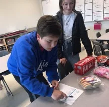 New members sign up to provide books for libraries to help young women in developing countries who want to read.