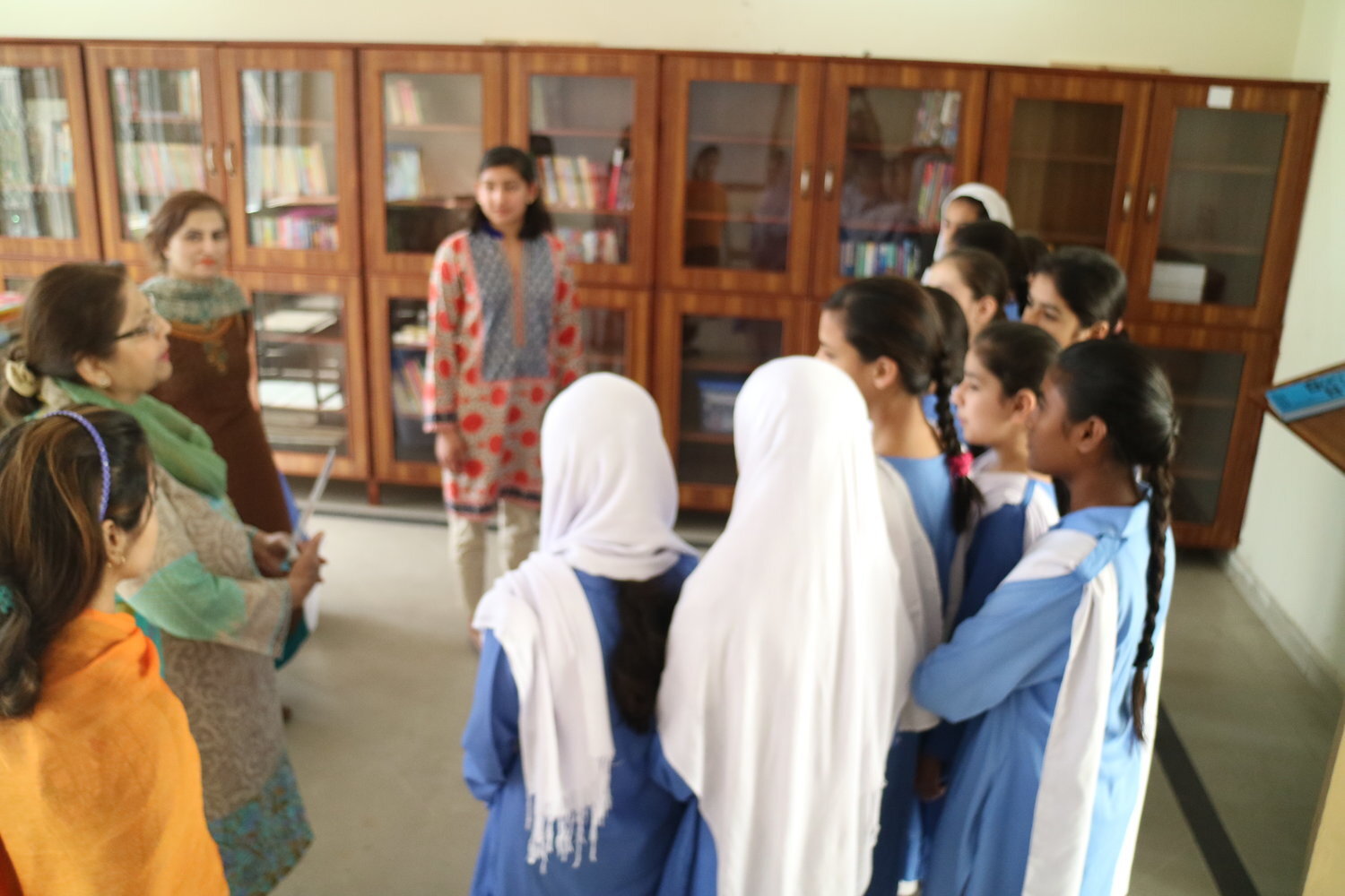  Zoha and her grandmother speaking to students in the Lahore school. 