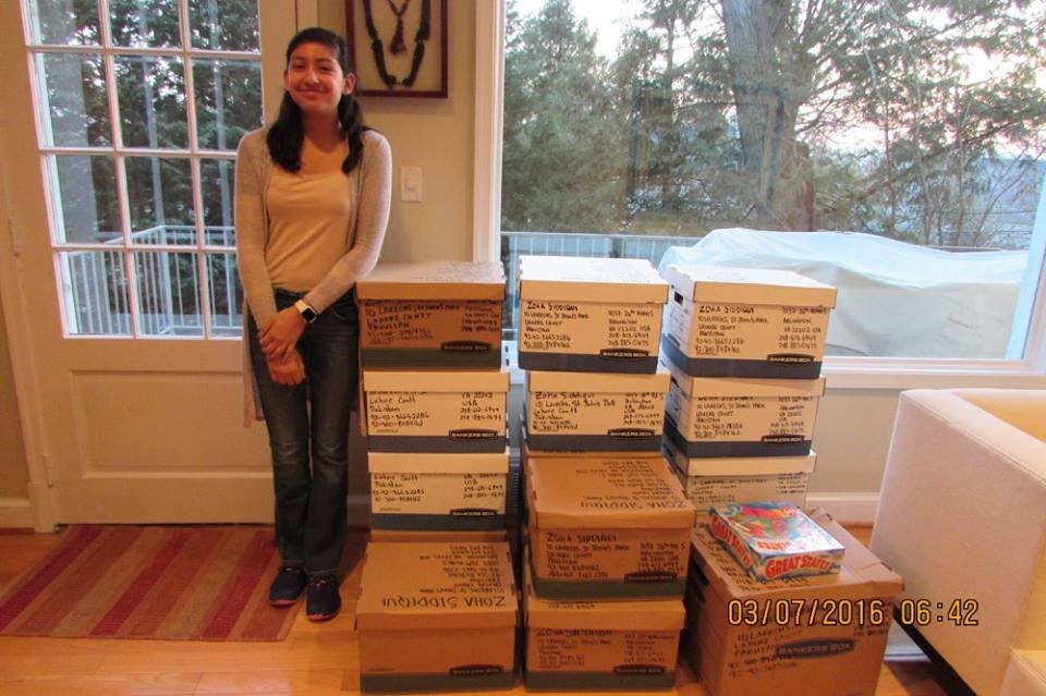  Zoha with boxes of books before the Pakistani Embassy shipped them to Lahore. 