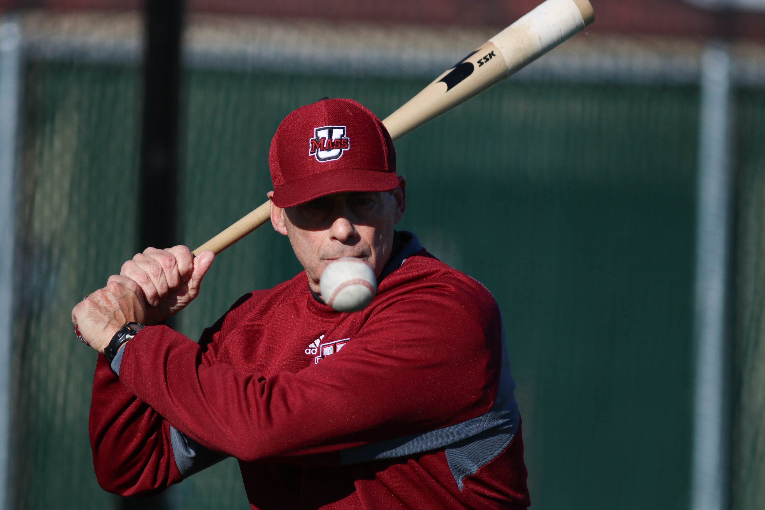UMass baseball coach Mike Stone bats during practice on Garber Field February 17, 2017.