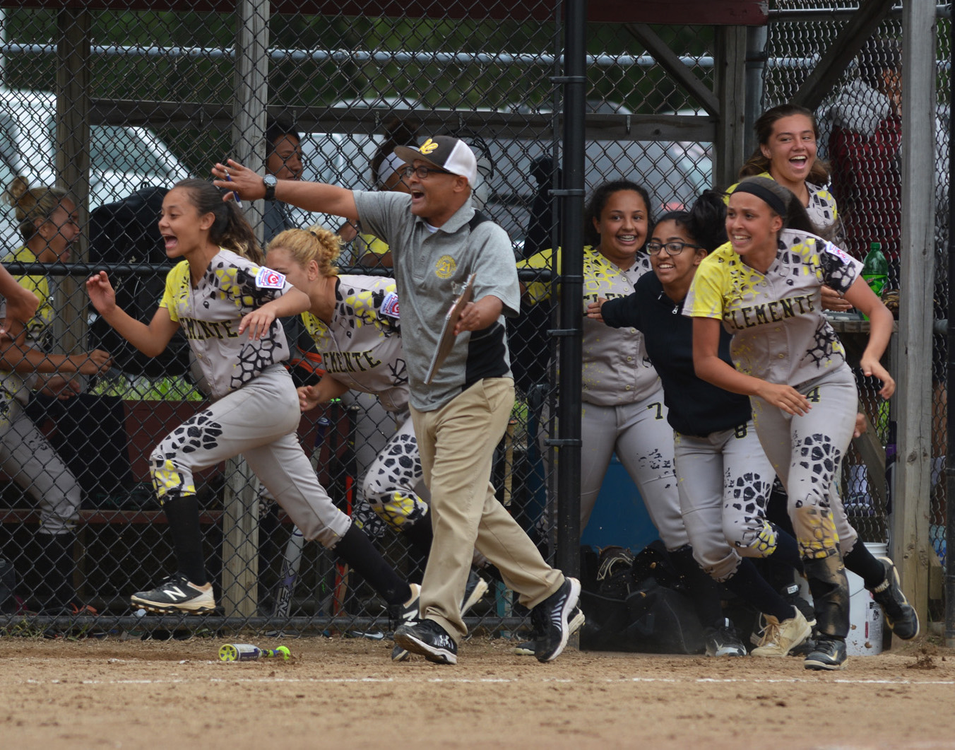 The New Jersey team runs from the dugout to celebrate a run during their Senior Girls East Regional semifinal game against Jesse Burkett at Ty Cobb Field July 27, 2017. 