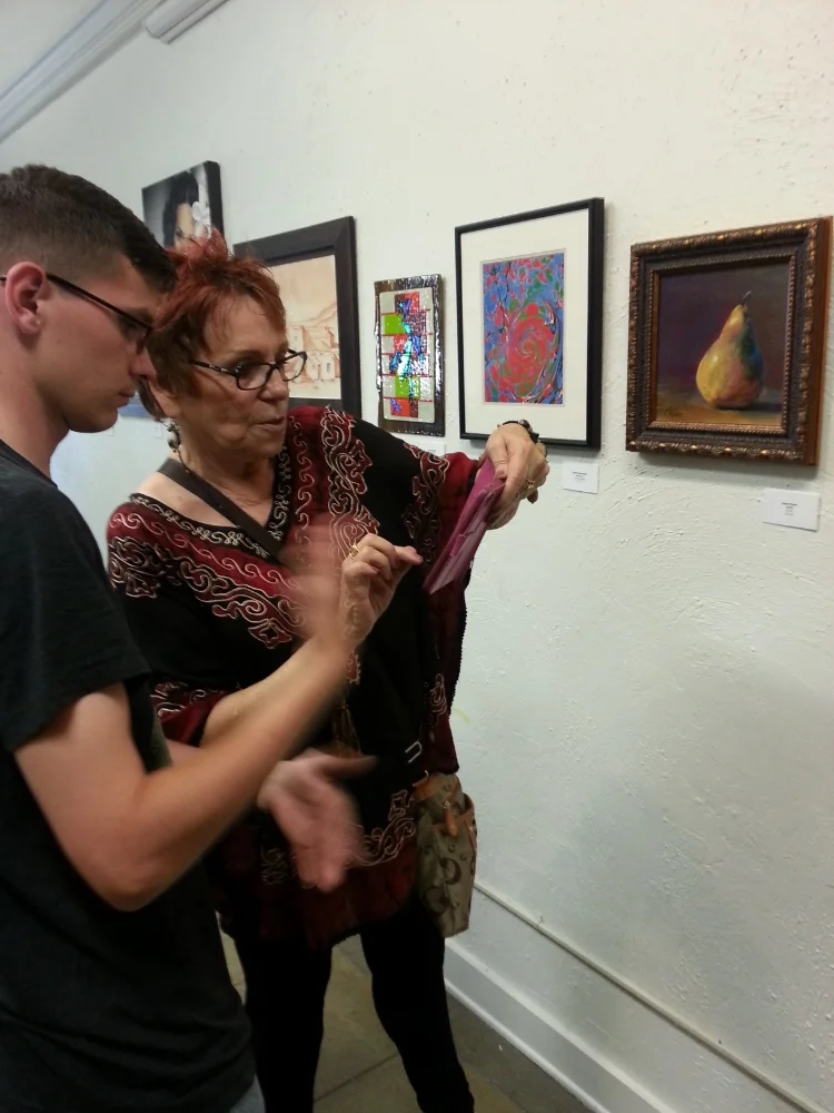 The lovely Laura Ryan and her pear painting; part of The 52 Project group exhibit