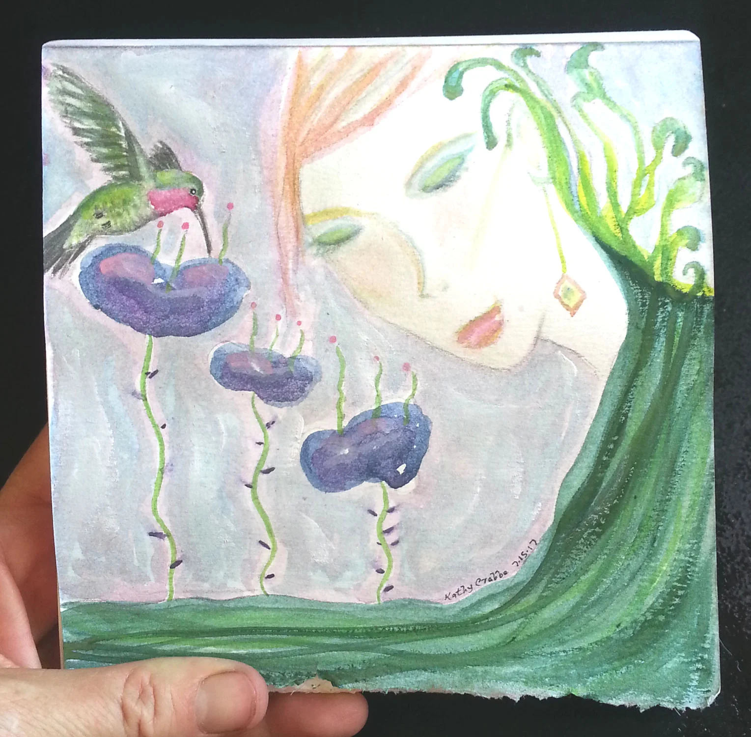 Hummingbird in hand.jpg