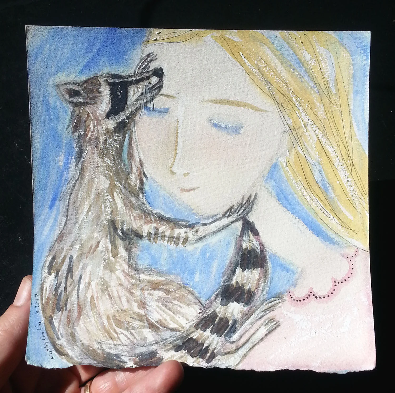 RAcoon in hand.jpg