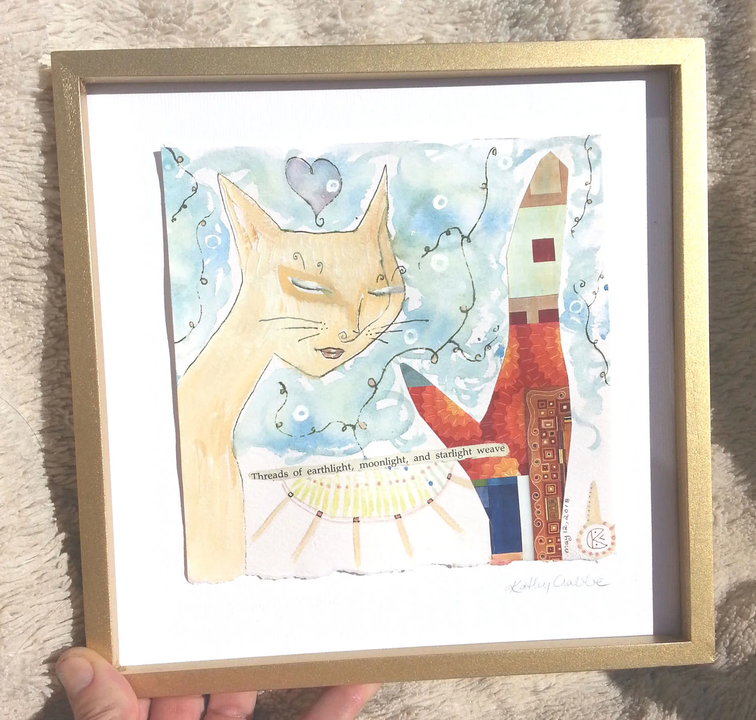Threads of earthlight framed in hand.jpg
