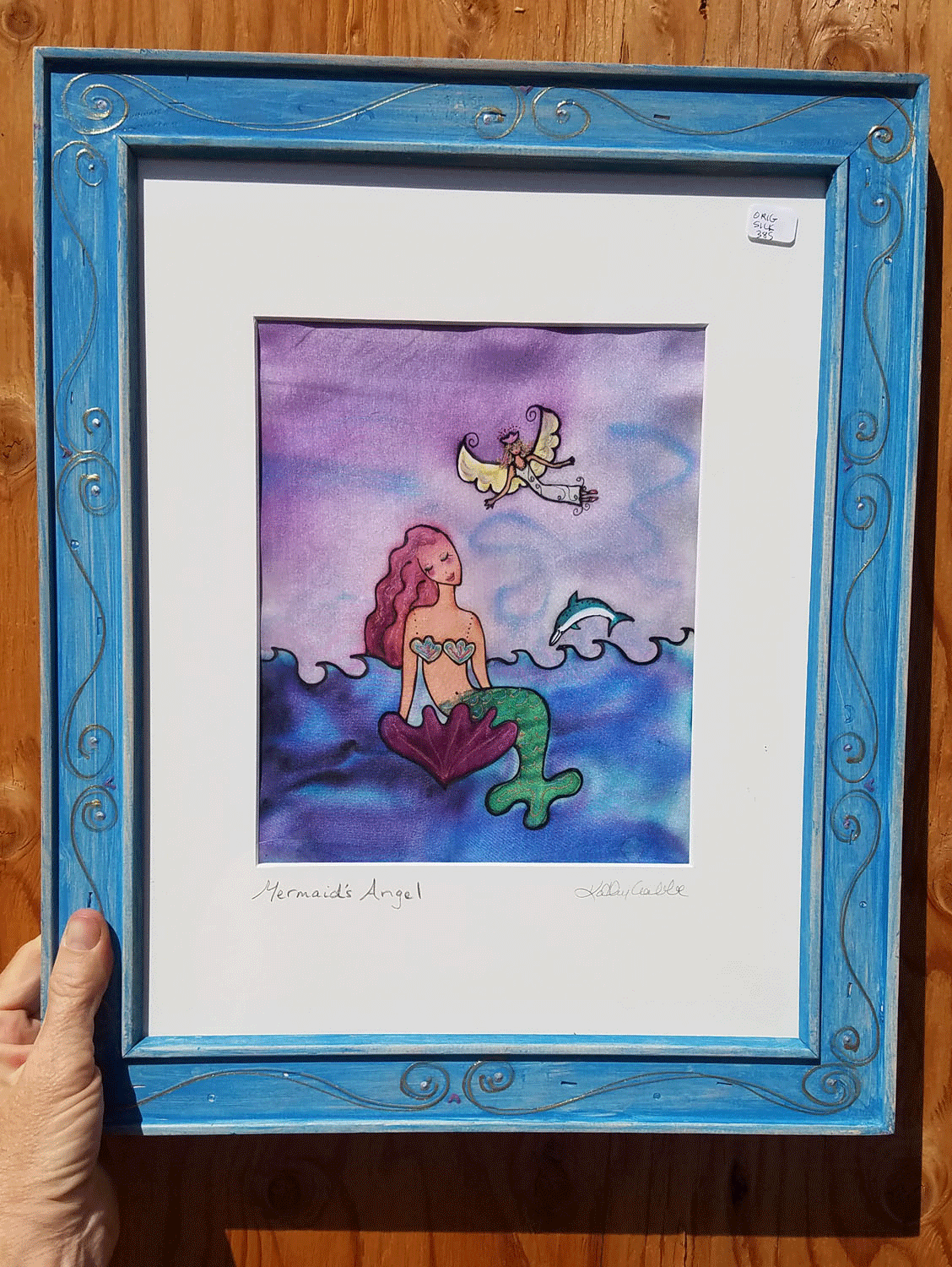 Mermaid's-Angel-Framed-Orig.gif