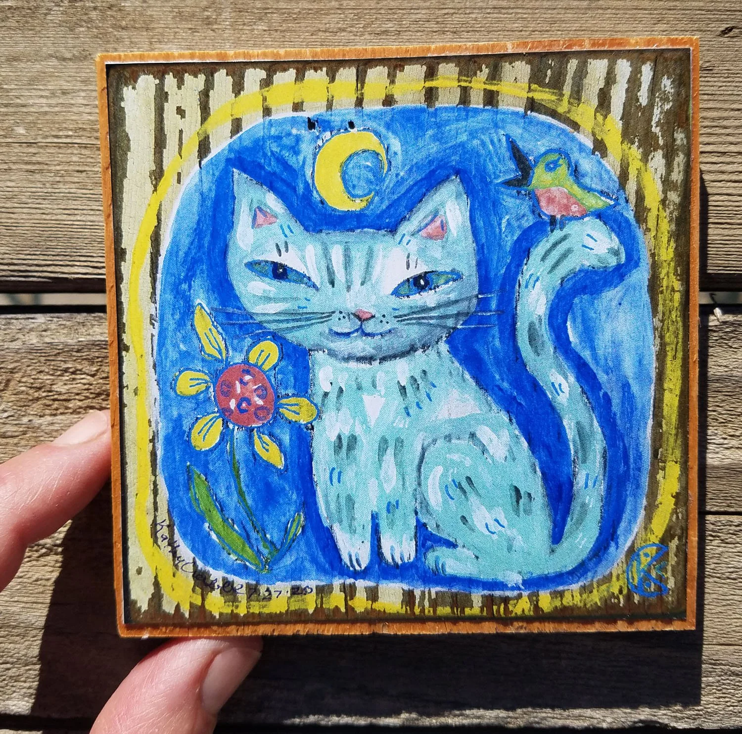 Joy print on wood in hand 4 x 4.jpg