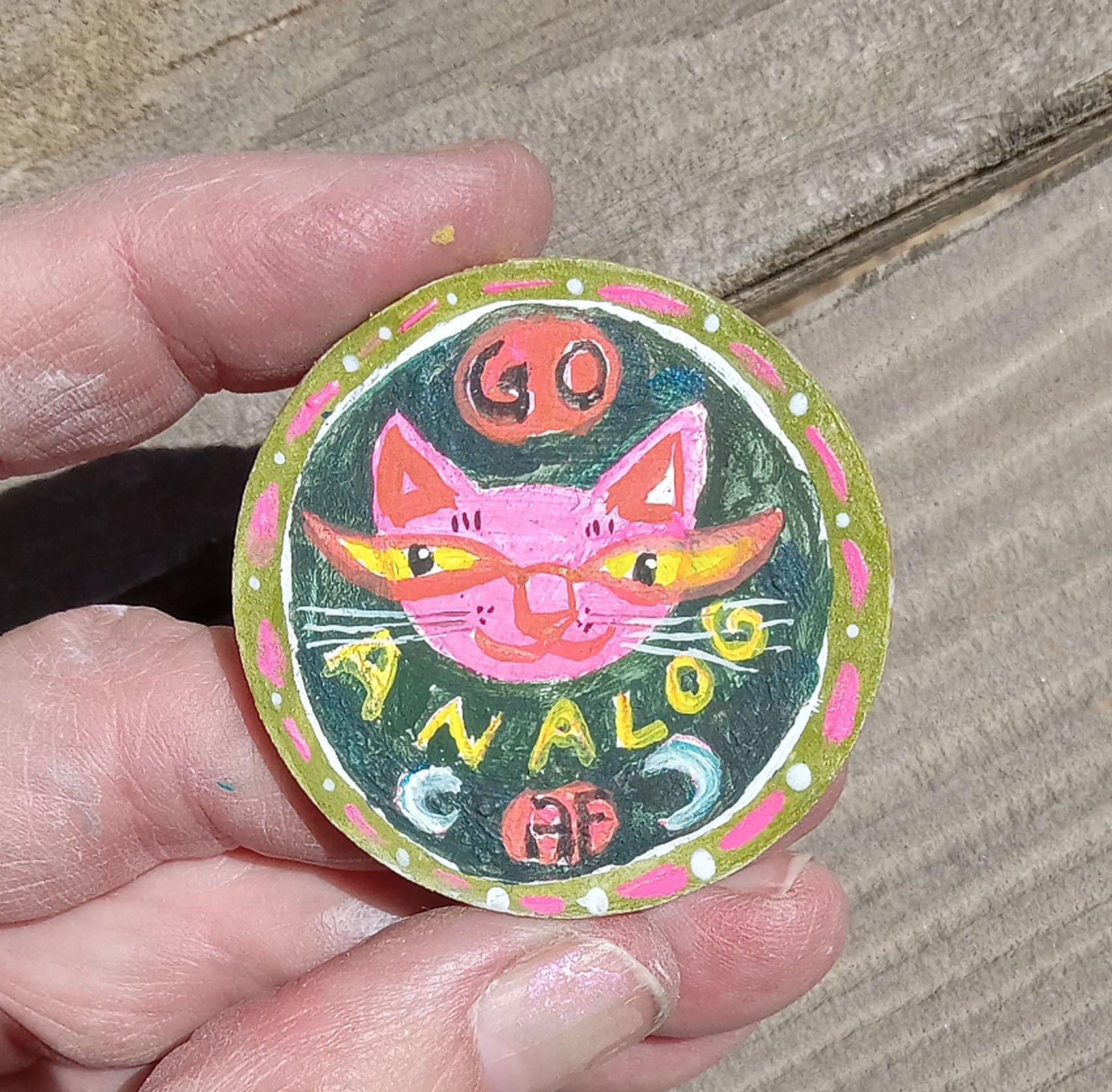 analog pin front in hand.jpg