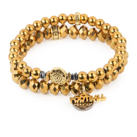 Touchdown (Set of Two) Gold hematite and crystal glass bracelet set of two with mixed metal detail and football charms. Measures approximately 7.5" in length. With the purchase of this bracelet, 25% of gross profit goes to Pencils of Promise. All bracelet sets come with a pouch and a hang-tag detailing the mission of each charity.