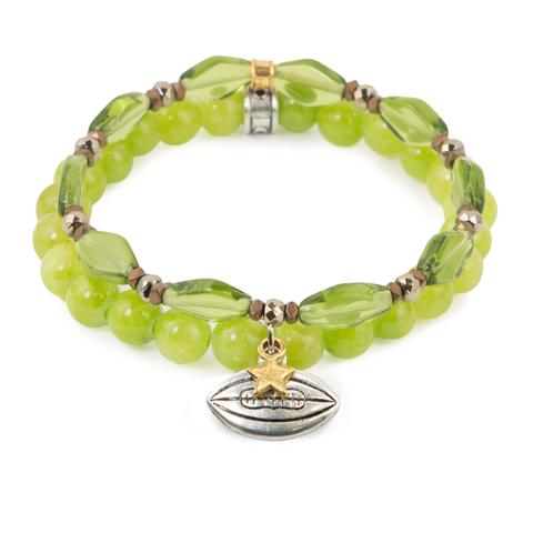 Football Star (Set of Two) Green Czech glass and dyed jade bracelet set of two with hematite detail and mixed metal football charms. Measures approximately 7.5" in length. With the purchase of this bracelet set, 25% of gross profit goes to the Whole Planet Foundation. All bracelet sets come with a pouch and a hang-tag detailing the mission of each charity. 