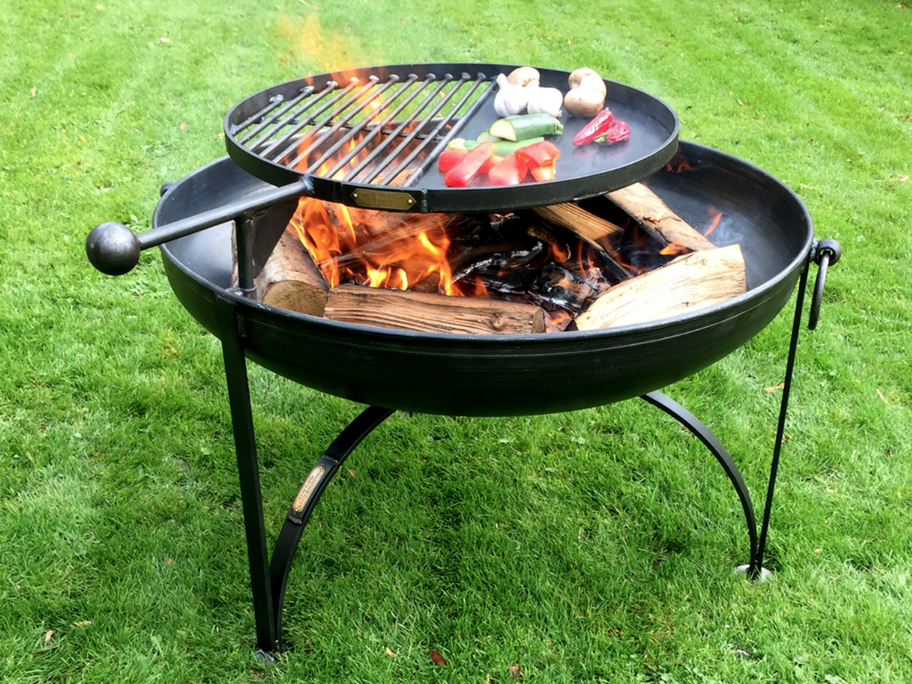 Wood-Burning Fire Pits Practical yet functional with three sizes available, and the swing arm is fully removable by simply lifting off post cooking allowing him to enjoy the warmth, light and atmosphere of this fire pit late into the evening.