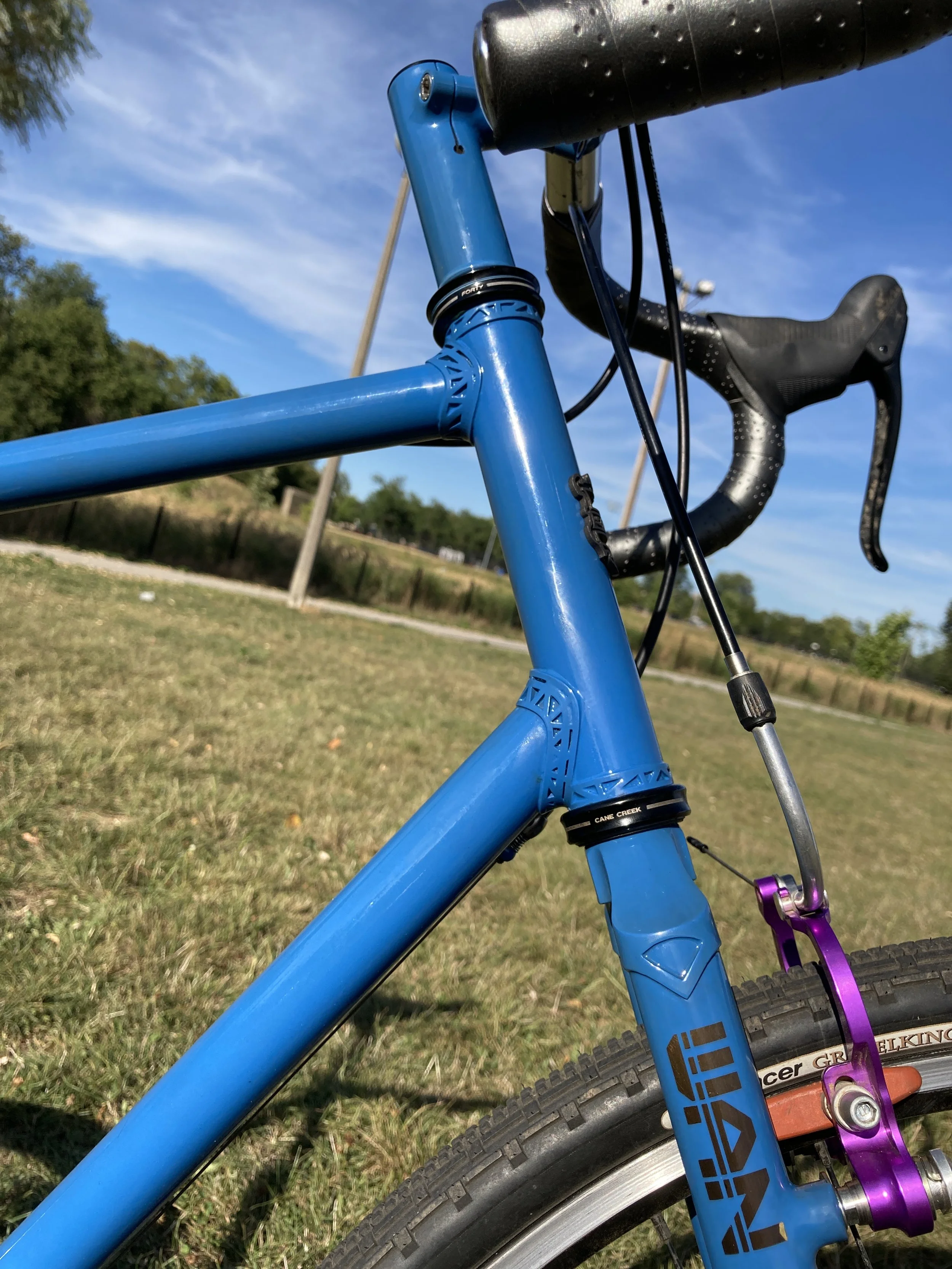  Lugged construction with custom designed and 3D printed stainless steel lugs   Steel tubing, Columbus ZONA   High temp wet paint with masked metal branding, beneath clear powder coat finish   Used components (SRAM Rival), 700c wheels, Paul cantileve