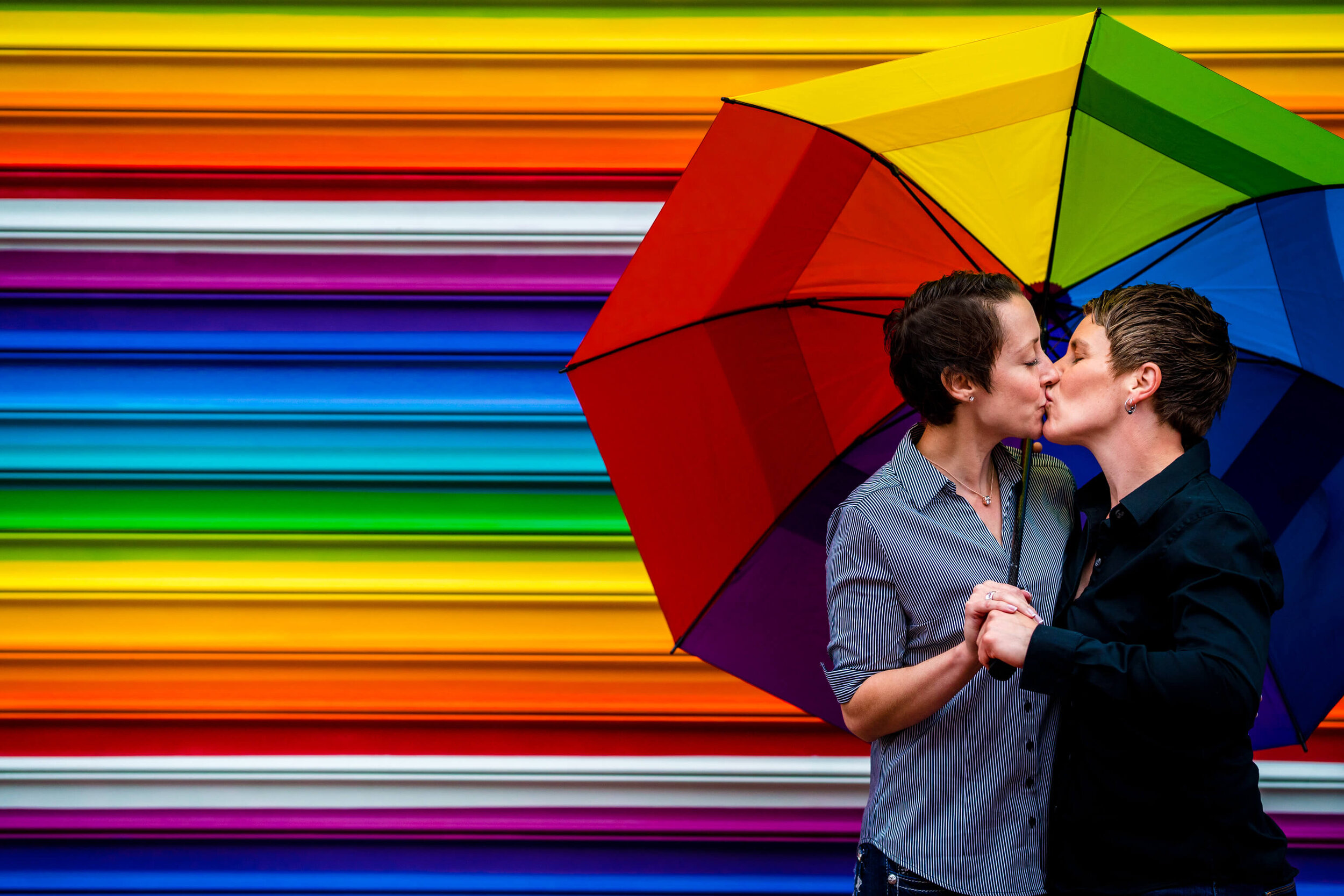 4-love-mural-washington-dc-blagden-alley-two-brides-same-sex-engagement-session-rainbow-wall-umbrella-Edit-photography-by-bee-two-sweet.jpg