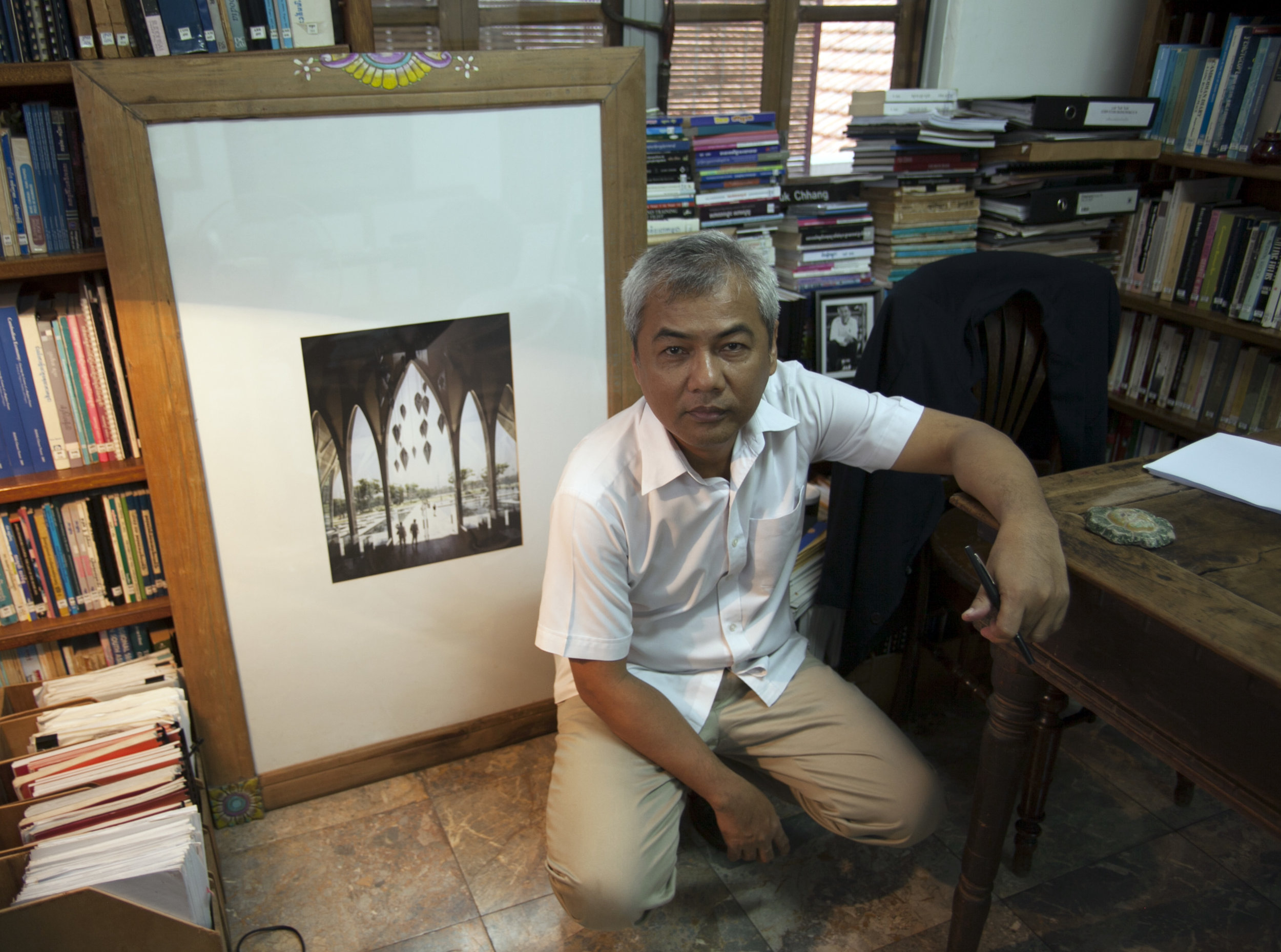 Youk Chhang, Director of the Document Centre Cambodia, with architectural design by Zaha Hadid for the Sleuk Rith Institute. Image courtesy of Brook Andrew.