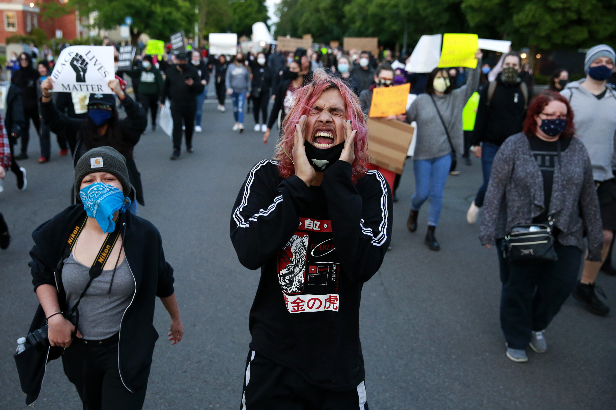  Jacob Hernandez of Salem leads a chant during a protest against police brutality in Salem, Oregon, on Sunday, May 31, 2020. 