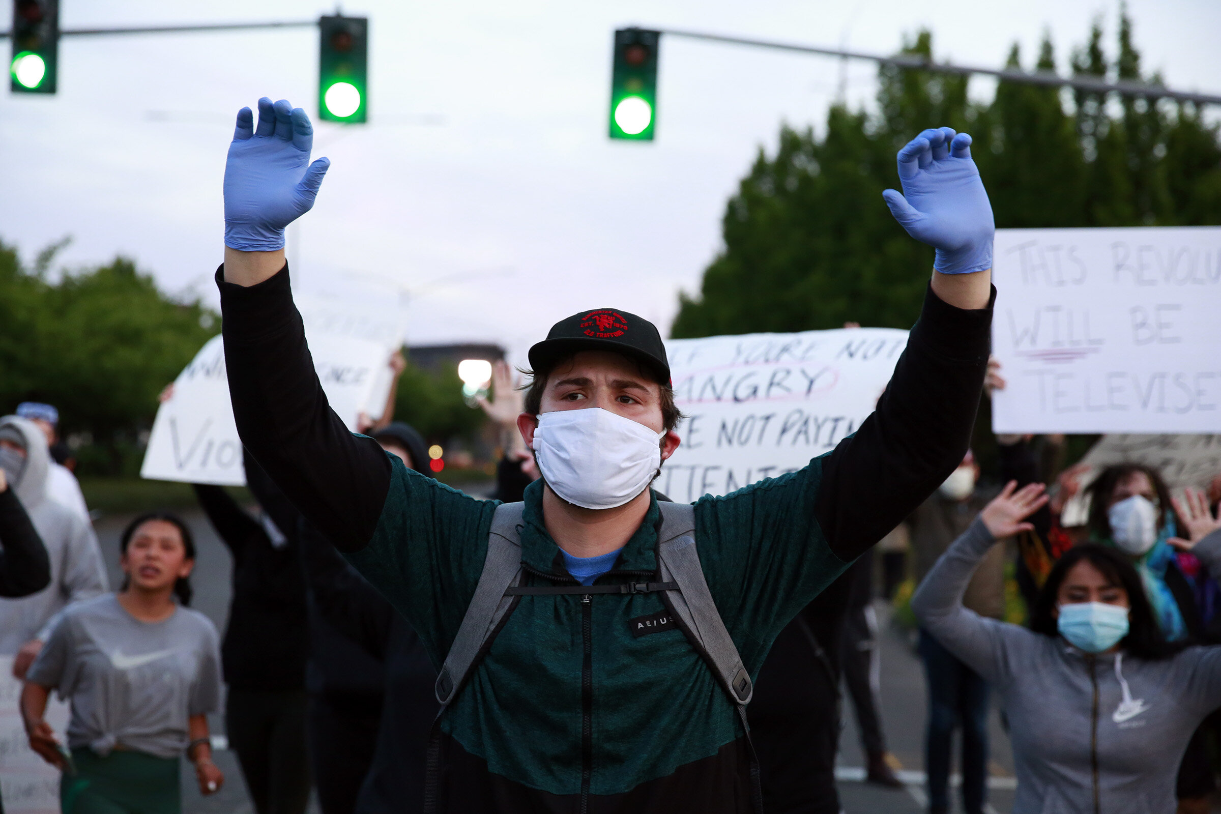  Protesters chant “hands up, don’t shoot” while blocking traffic on Front Street in Salem, Oregon, on Sunday, May 31, 2020. 