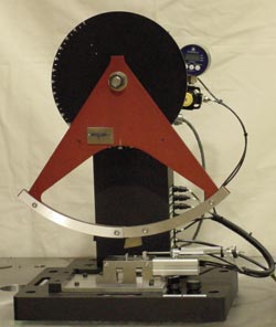 Figure 1 - Table Top Plastic Test Machine for Izod, Charpy, and Dynamic Tensile Testing (photo shows pneumatic Izod clamp with user controlled clamping force).