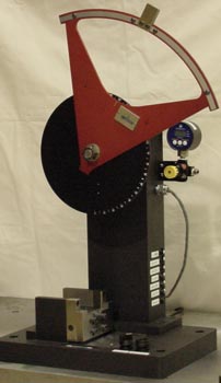 Figure 2 - This Photo Shows the Charpy Testing Configuration. The Pendulum has the Essential Weight Plates that Bring the Pseudo-Mass to 1.0 lb for a Nominal 2 ft-lb Baseline Energy Capacity.