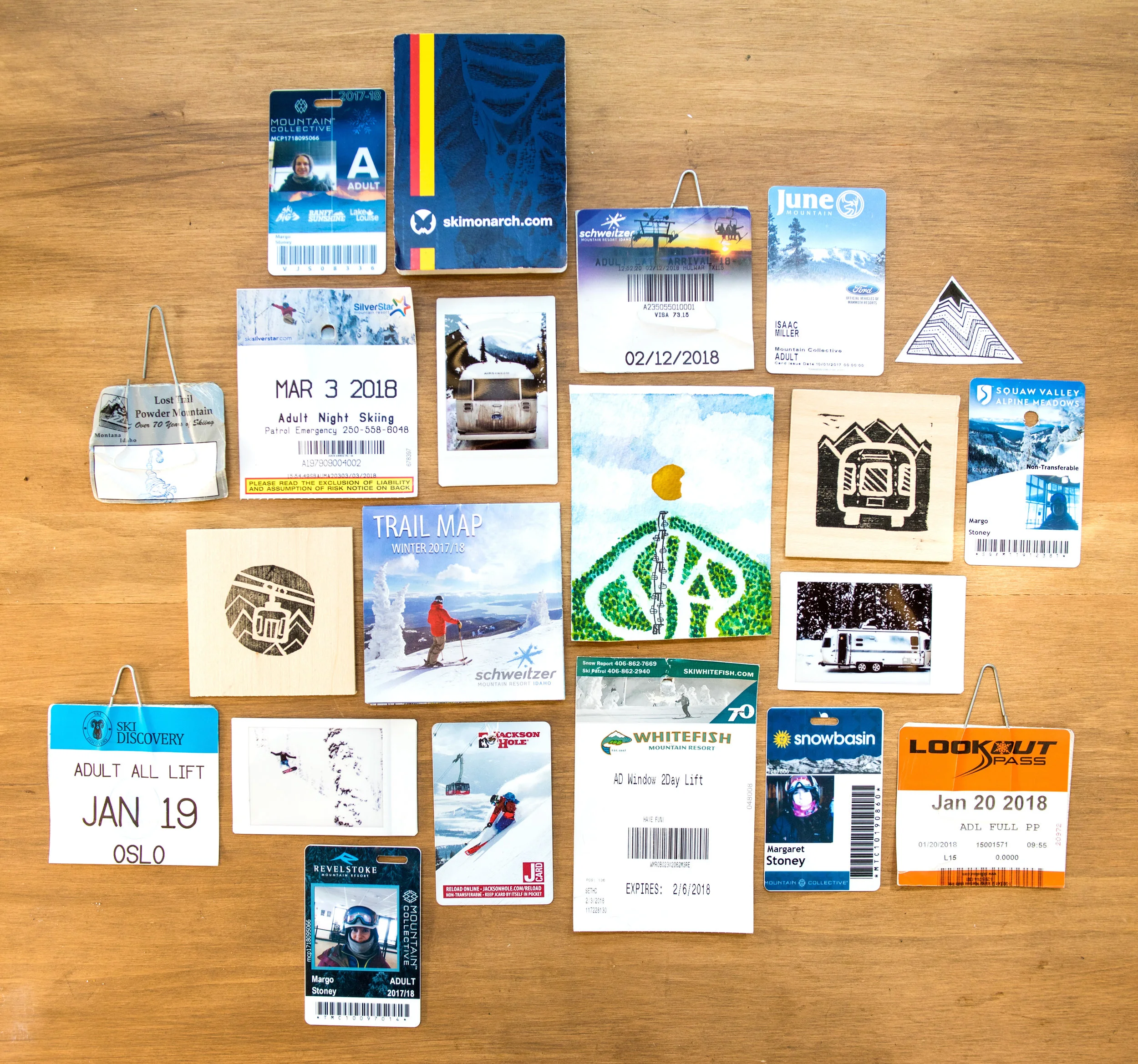 A scrapbook collection of lift tickets, ski passes, trail maps, photos and artwork from along the way.