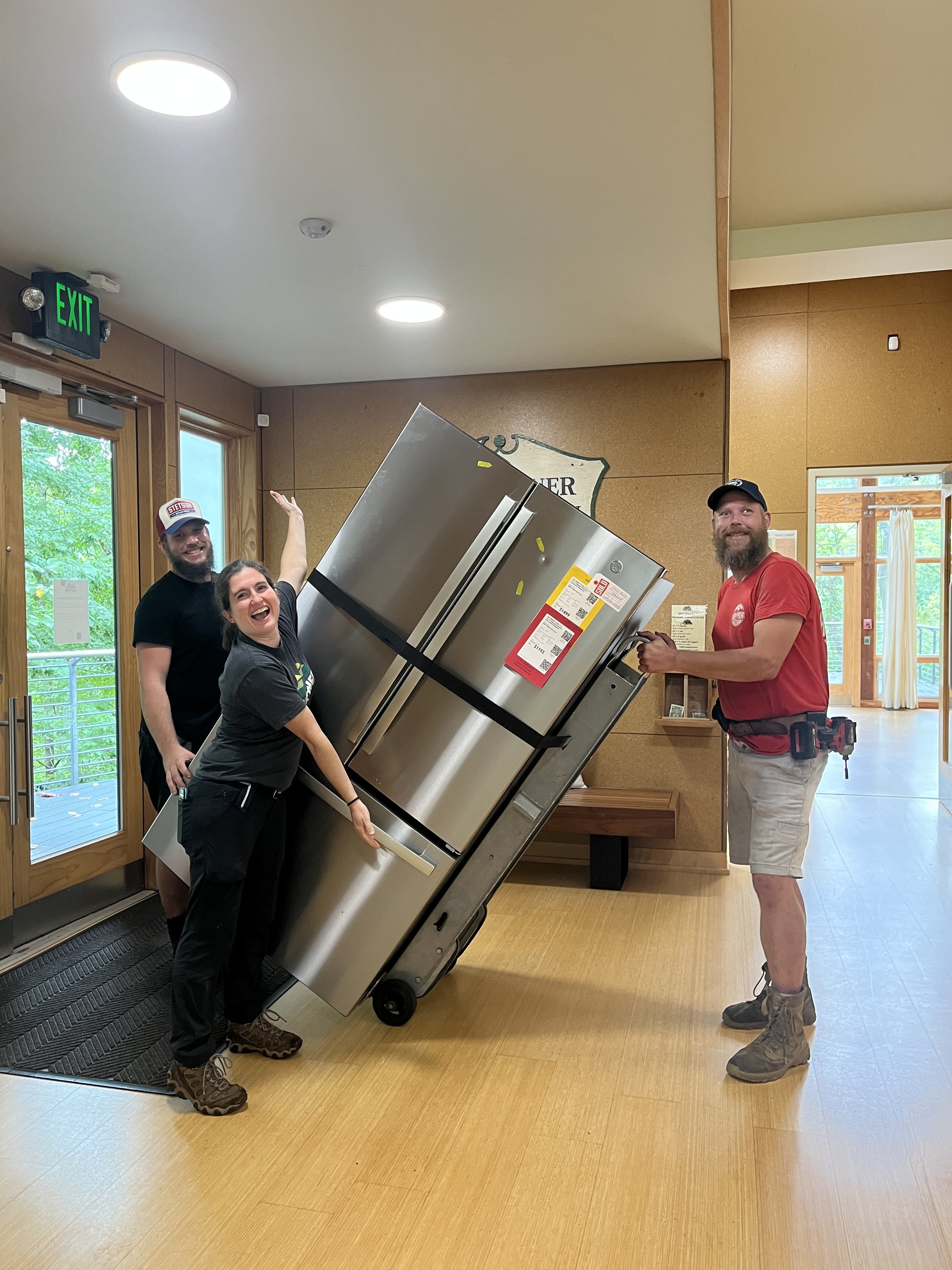    Wildlife Care Naturalist, Emily, is overjoyed about the new refrigerator which will allow for more storage for animal ambassador food and supplies!   