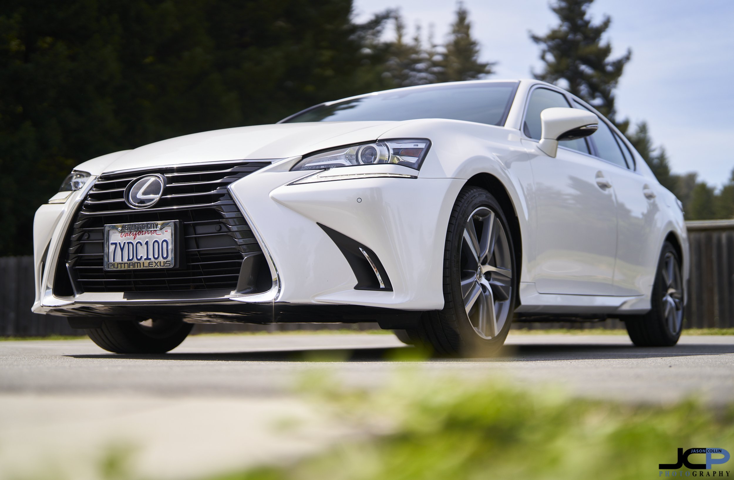 White Lexus sedan photographed for a Cars & Bids auction listing in Monterey, California