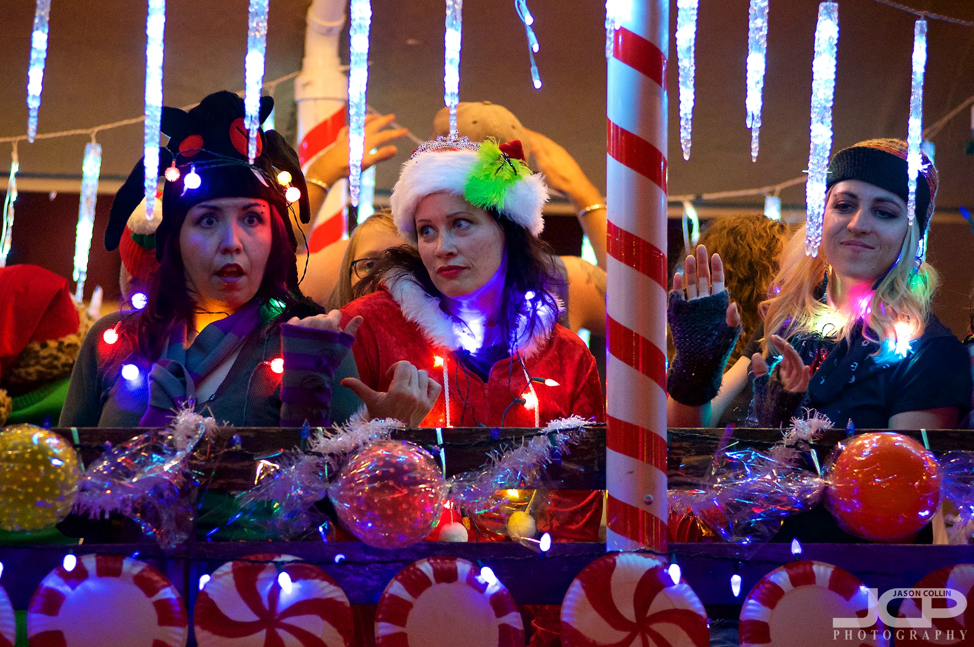 I love the very different expressions on each woman's face as they sing and dance on this float! - Nikon D750 with Nikkor 80-200mm f/2.8D @ f/2.8 1/200th ISO 4000