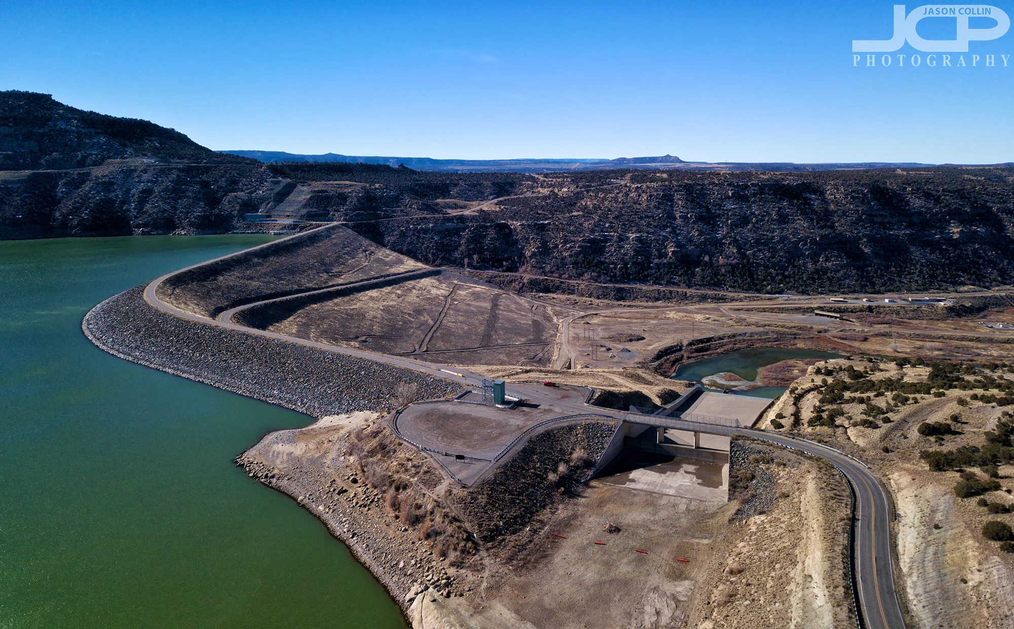 Navajo Lake on one side and the San Juan River on the other of Navajo Dam - DJI Mavic Pro drone image