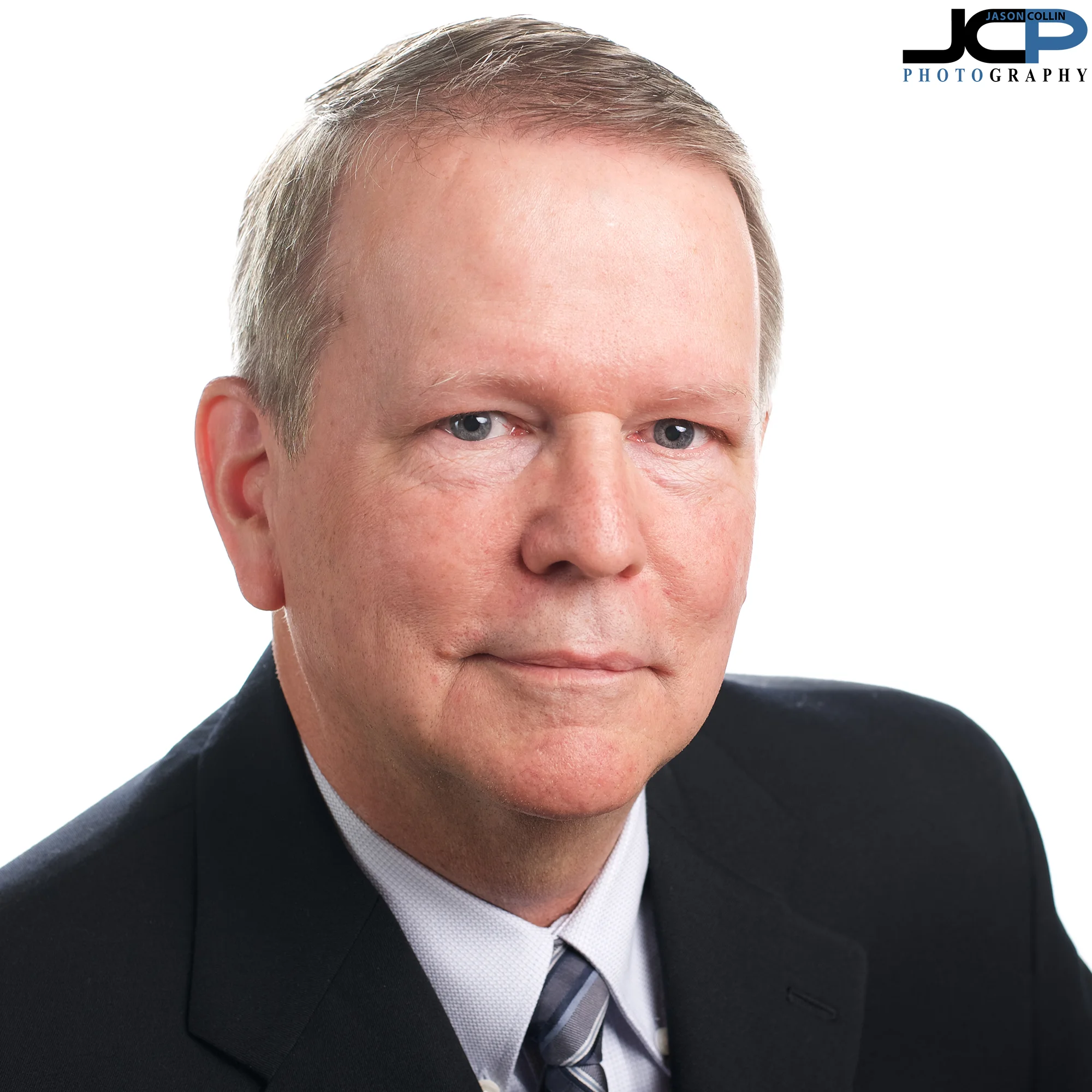 Mark wanted one headshot with a conservative business look. I used three lights to make this shot and still added some modern flair to this headshot with the pose and depth of field to help Mark standout on LinkedIn and be noticed by potential employers.