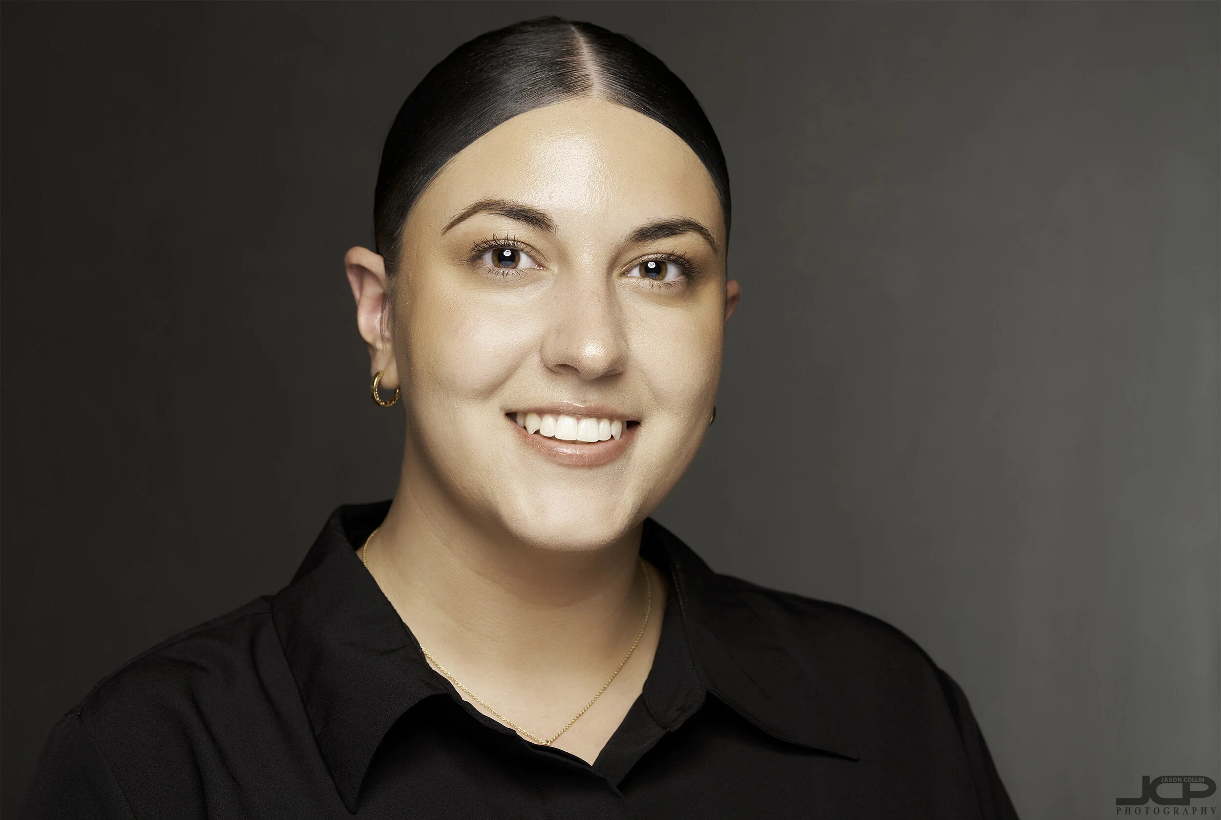 Professional Business headshot gray background in Albuquerque with Andrea