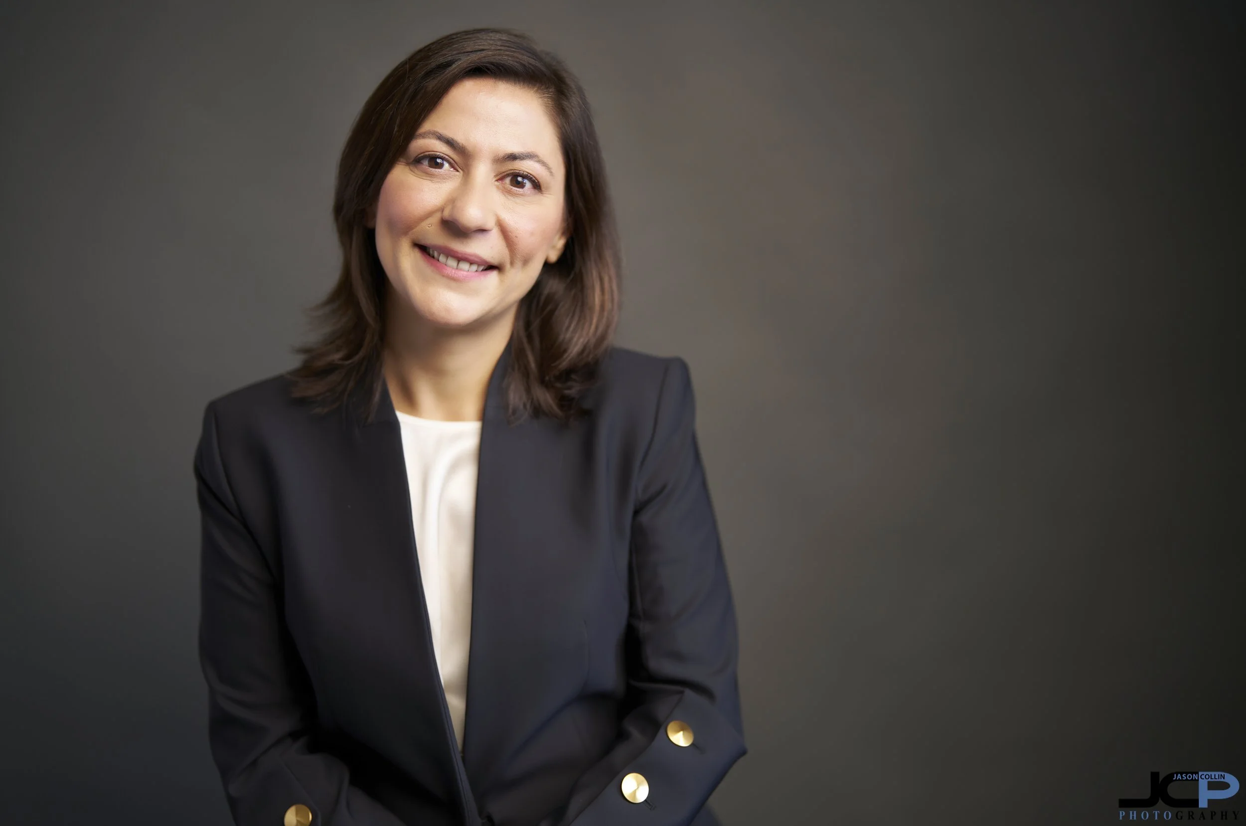 Campaign headshot of Burcu Mousa, Monterey County Auditor-Controller candidate, photographed in Jason Collin’s Pacific Grove studio with professional lighting and a clean, confident look.