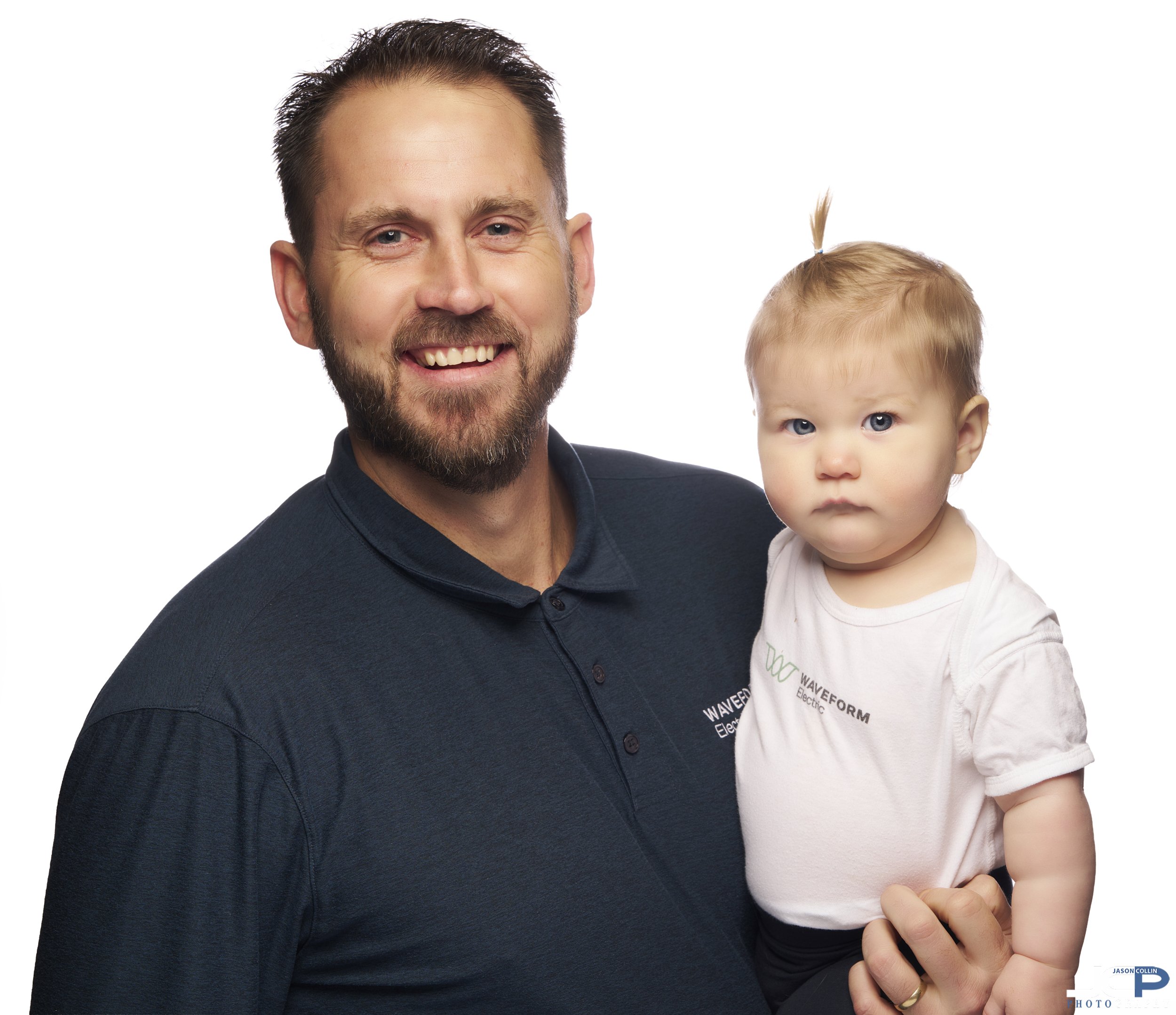 Close-up Pacific Grove on-location portrait of the Waveform owner and his young child for brand authenticity.