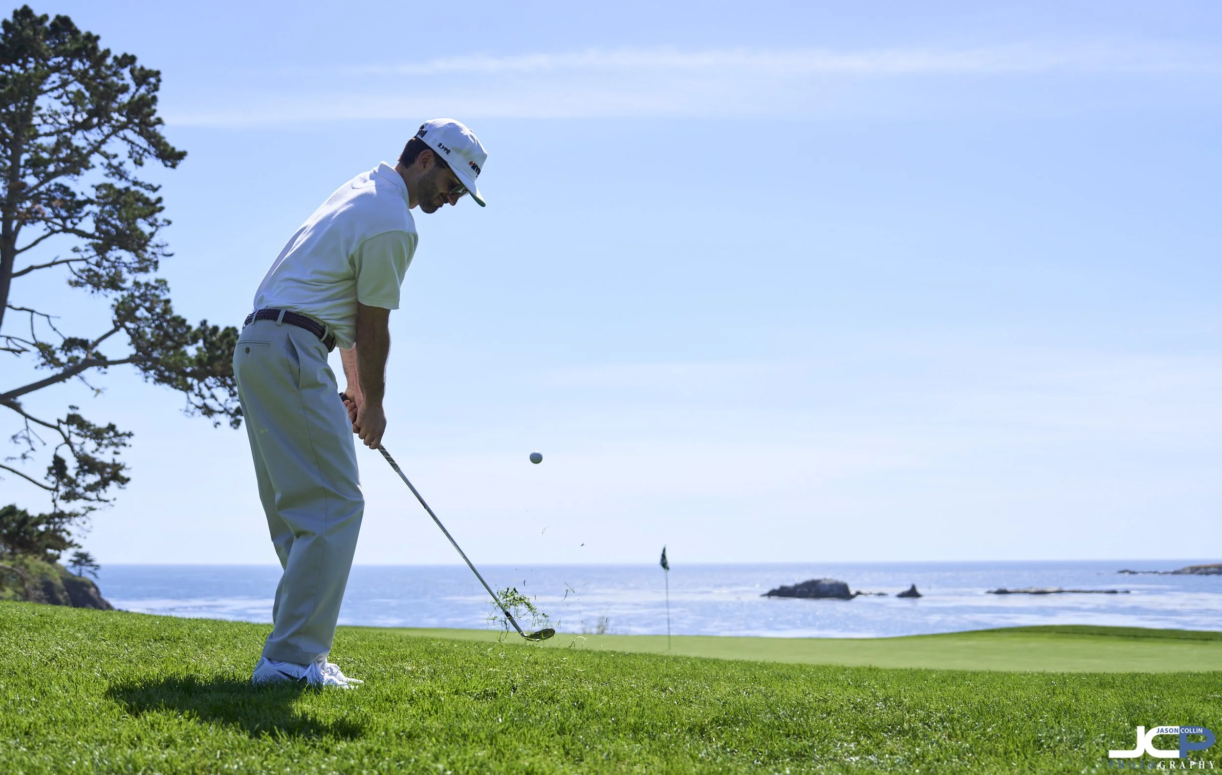 golfer chipping onto the green at a famous Monterey area golf course