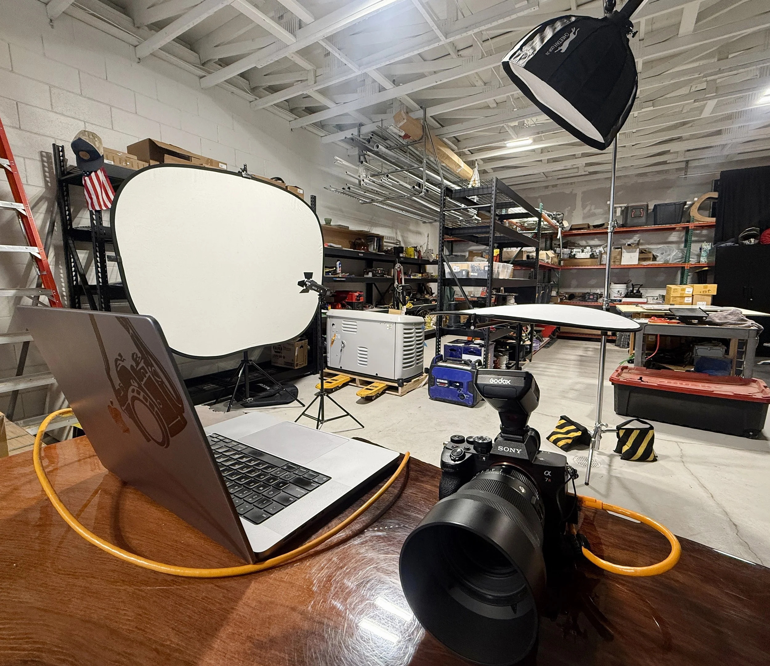 On-site studio setup in warehouse with lighting and backdrop used for professional headshots in Pacific Grove.